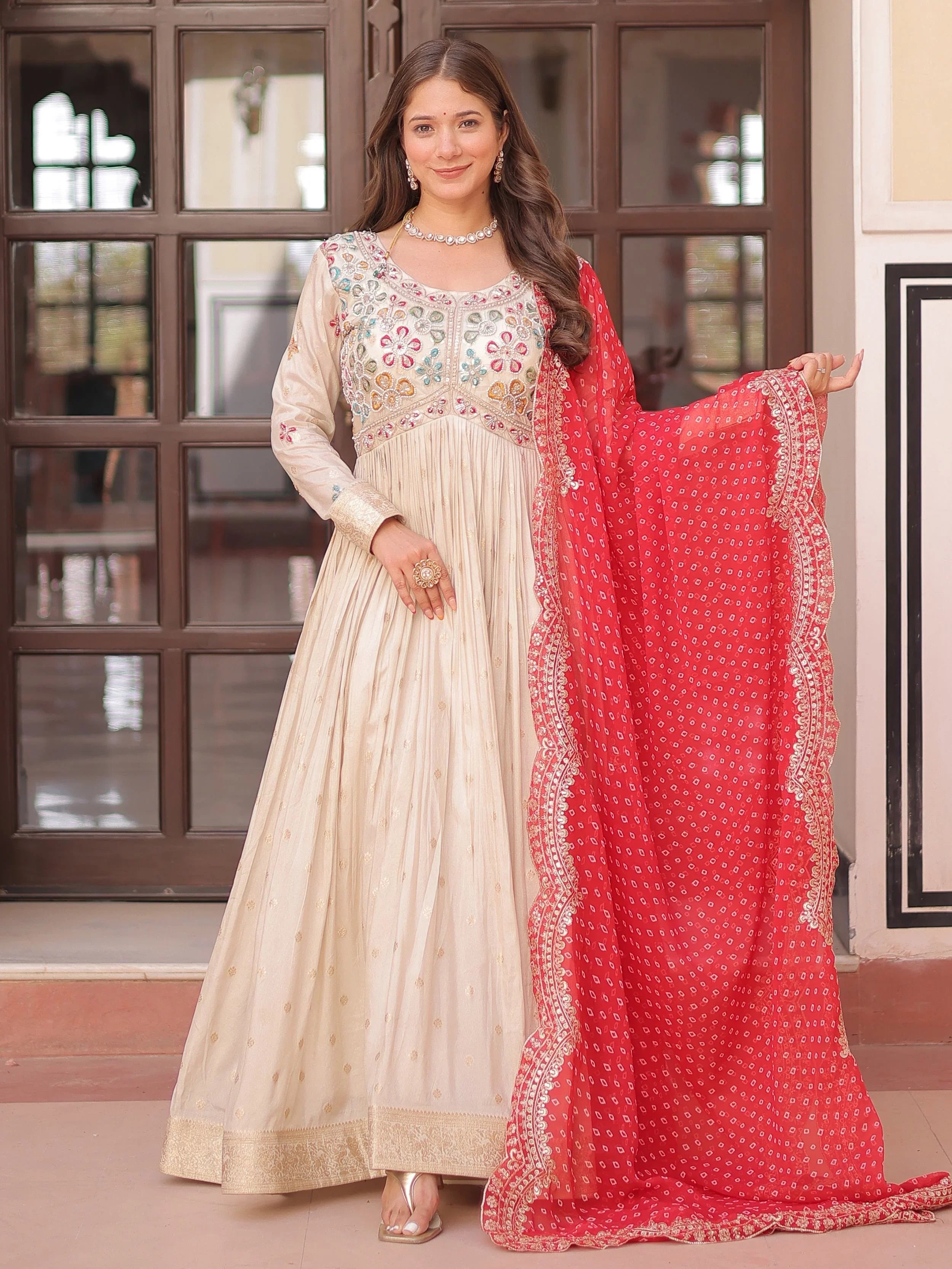 Shop Charming Cream Silk Pearl Gown With Bandhani Dupatta From Ethnic Plus XXL Shop Charming Cream Silk Pearl Gown With Bandhani Dupatta From Ethnic Plus XXL