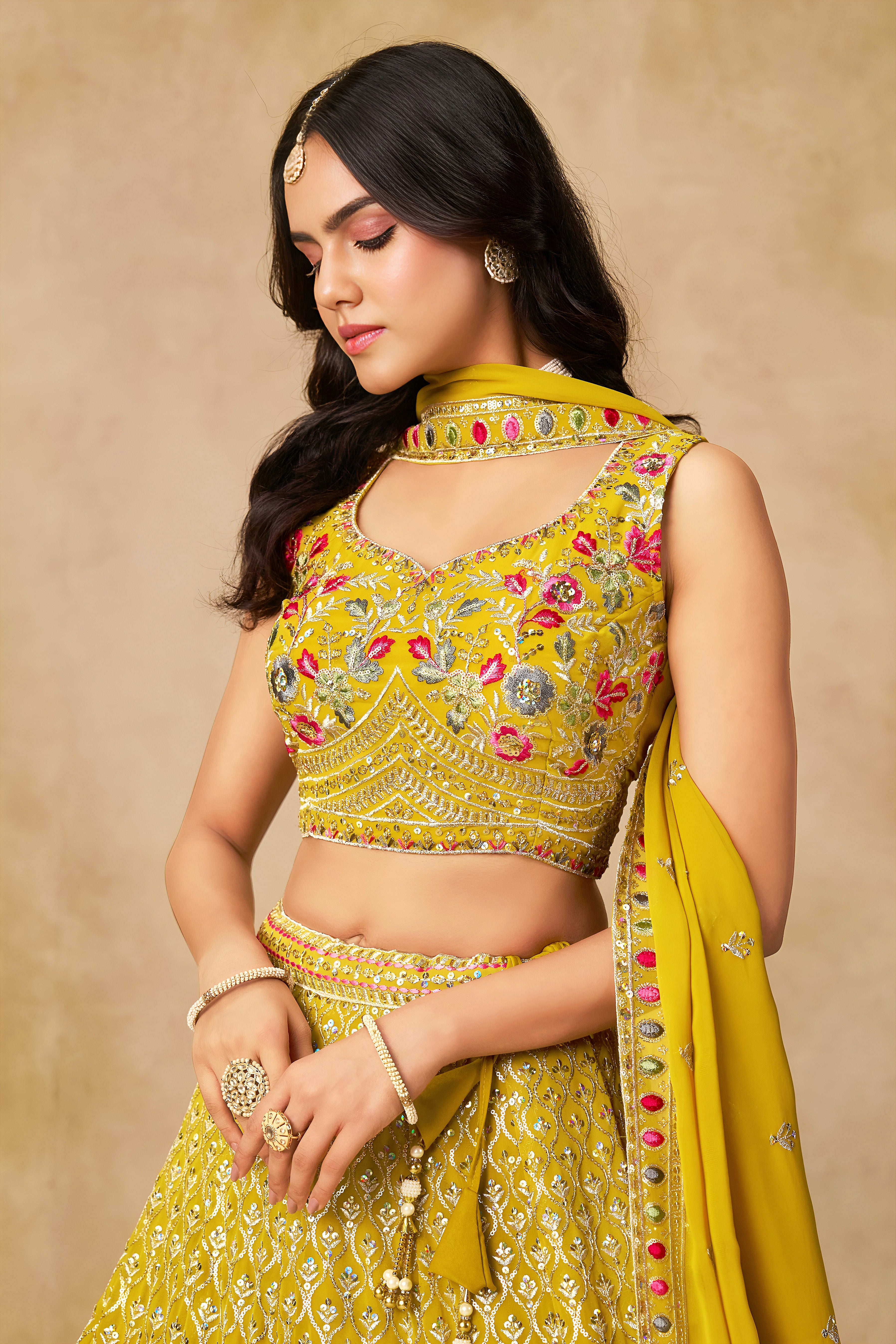 Sakhi Yellow Soft Georgette with Sequins Zari Resham and Badla Embroidery Work Lehenga Choli