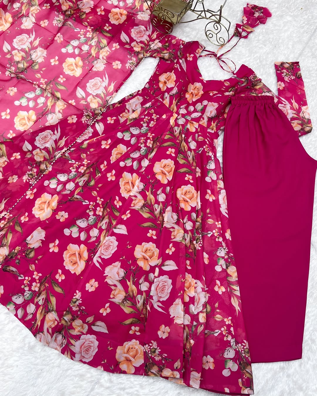 Aashvi Soft Organza Anarkali Suit Set – pastel pink fully stitched Anarkali kurta with 4-meter flair and canvas belt, paired with digitally printed micro cotton pants and a shawl-style lace border dupatta, premium soft organza festive suit for weddings, Diwali, Eid, or Raksha Bandhan, stylish and elegant ethnic set for women by Trinaari.