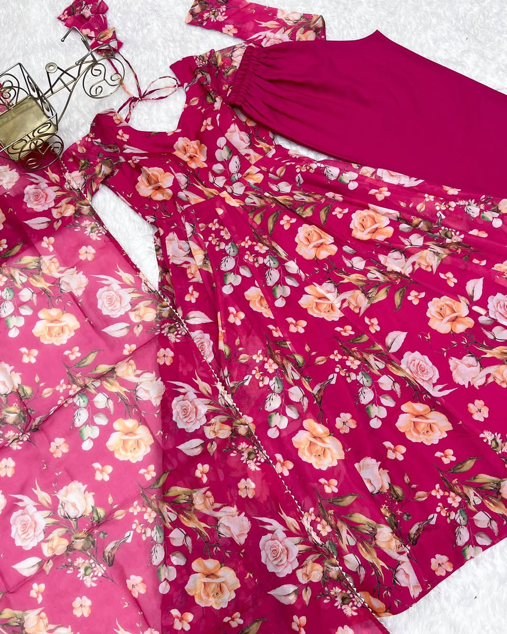 Aashvi Soft Organza Anarkali Suit Set – pastel pink fully stitched Anarkali kurta with 4-meter flair and canvas belt, paired with digitally printed micro cotton pants and a shawl-style lace border dupatta, premium soft organza festive suit for weddings, Diwali, Eid, or Raksha Bandhan, stylish and elegant ethnic set for women by Trinaari.