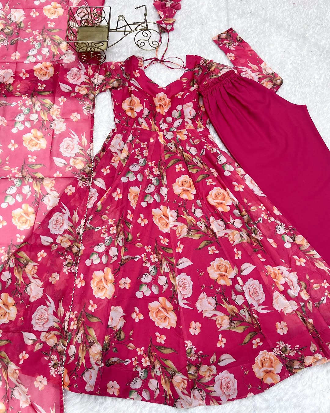 Aashvi Soft Organza Anarkali Suit Set – pastel pink fully stitched Anarkali kurta with 4-meter flair and canvas belt, paired with digitally printed micro cotton pants and a shawl-style lace border dupatta, premium soft organza festive suit for weddings, Diwali, Eid, or Raksha Bandhan, stylish and elegant ethnic set for women by Trinaari.