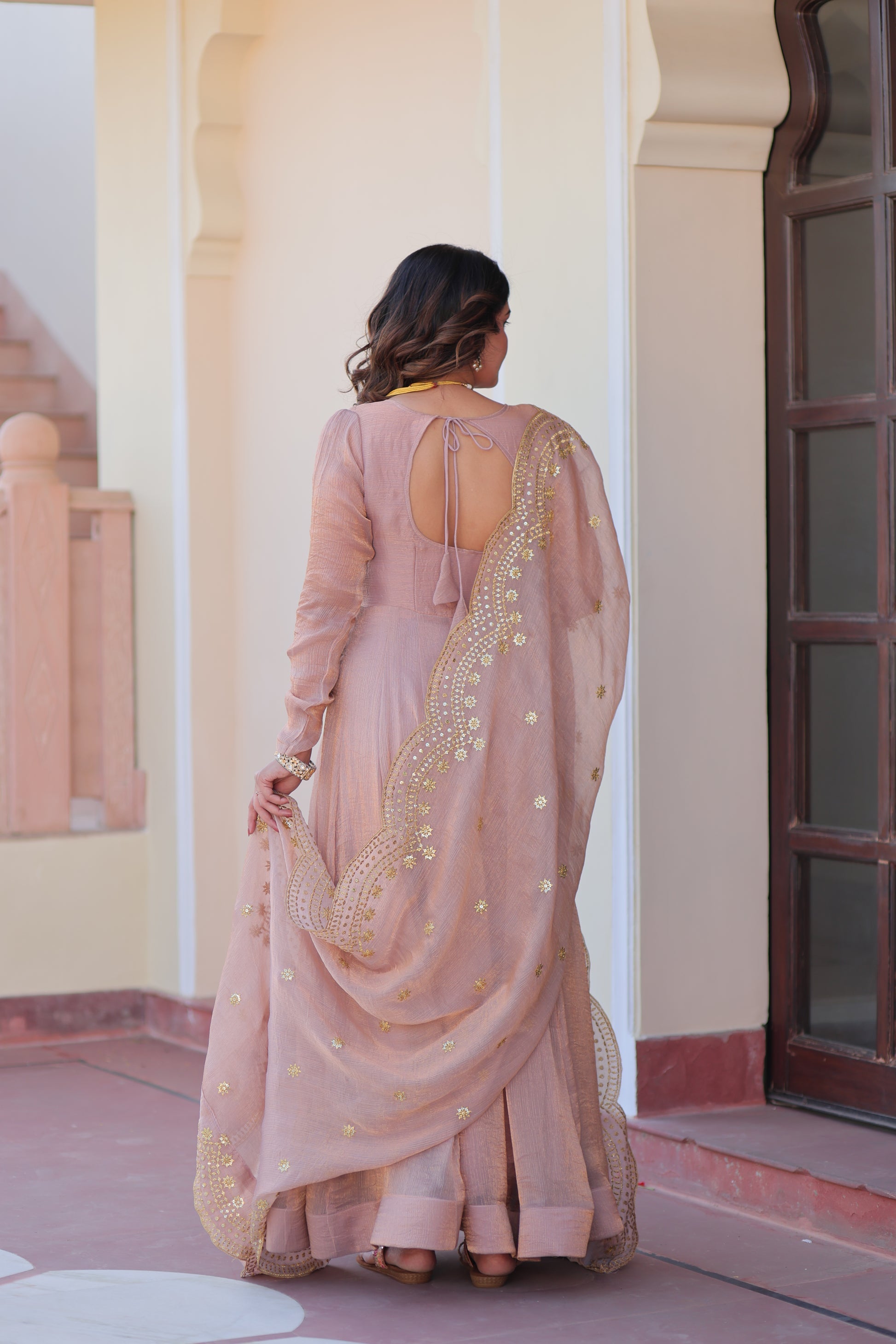Bhargavi Peach Gown Set – Fendy chiffon gown with 12 kali stitching and 3.5 meter flair, full sleeves, cotton lining, and canvas patta; paired with a sequin and zari embroidered cut-work dupatta – perfect for weddings, sangeet, and festive celebrations.
