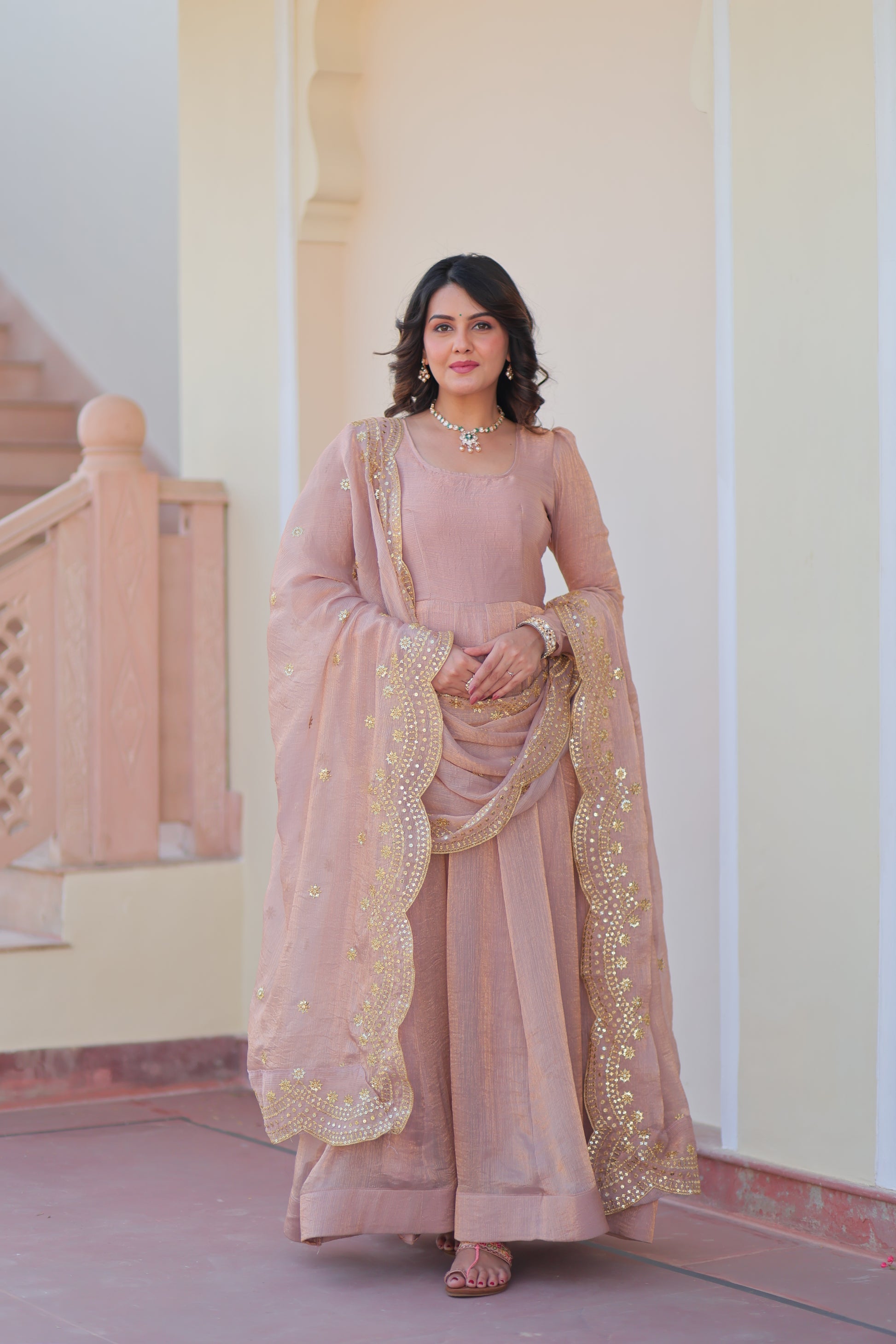 Bhargavi Peach Gown Set – Fendy chiffon gown with 12 kali stitching and 3.5 meter flair, full sleeves, cotton lining, and canvas patta; paired with a sequin and zari embroidered cut-work dupatta – perfect for weddings, sangeet, and festive celebrations.