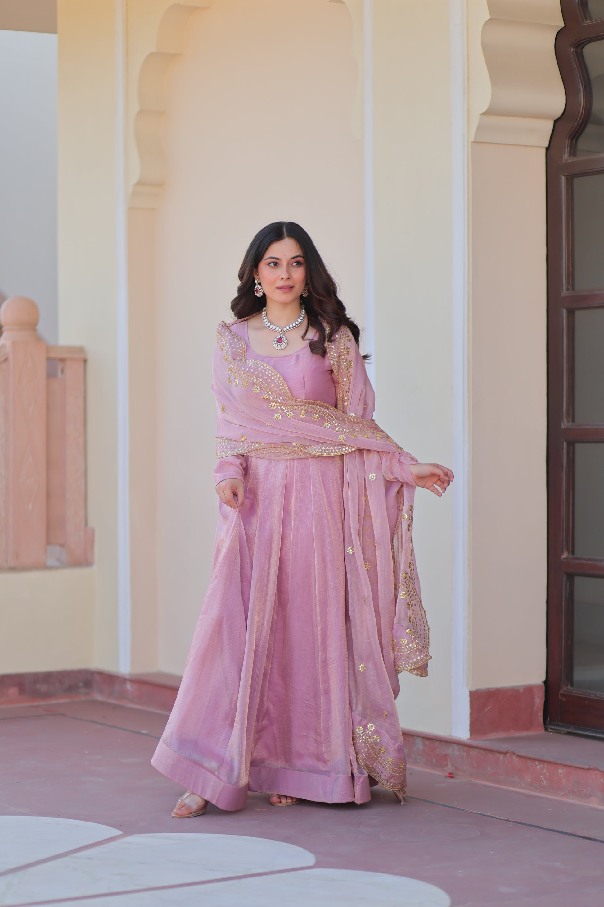 Bhargavi Pink Gown Set – Fendy chiffon gown with 12 kali stitching, full sleeves, and 3.5 meter flair; paired with a sequins and zari embroidered cut-work chiffon dupatta – ideal for weddings, sangeet, and festive occasions.