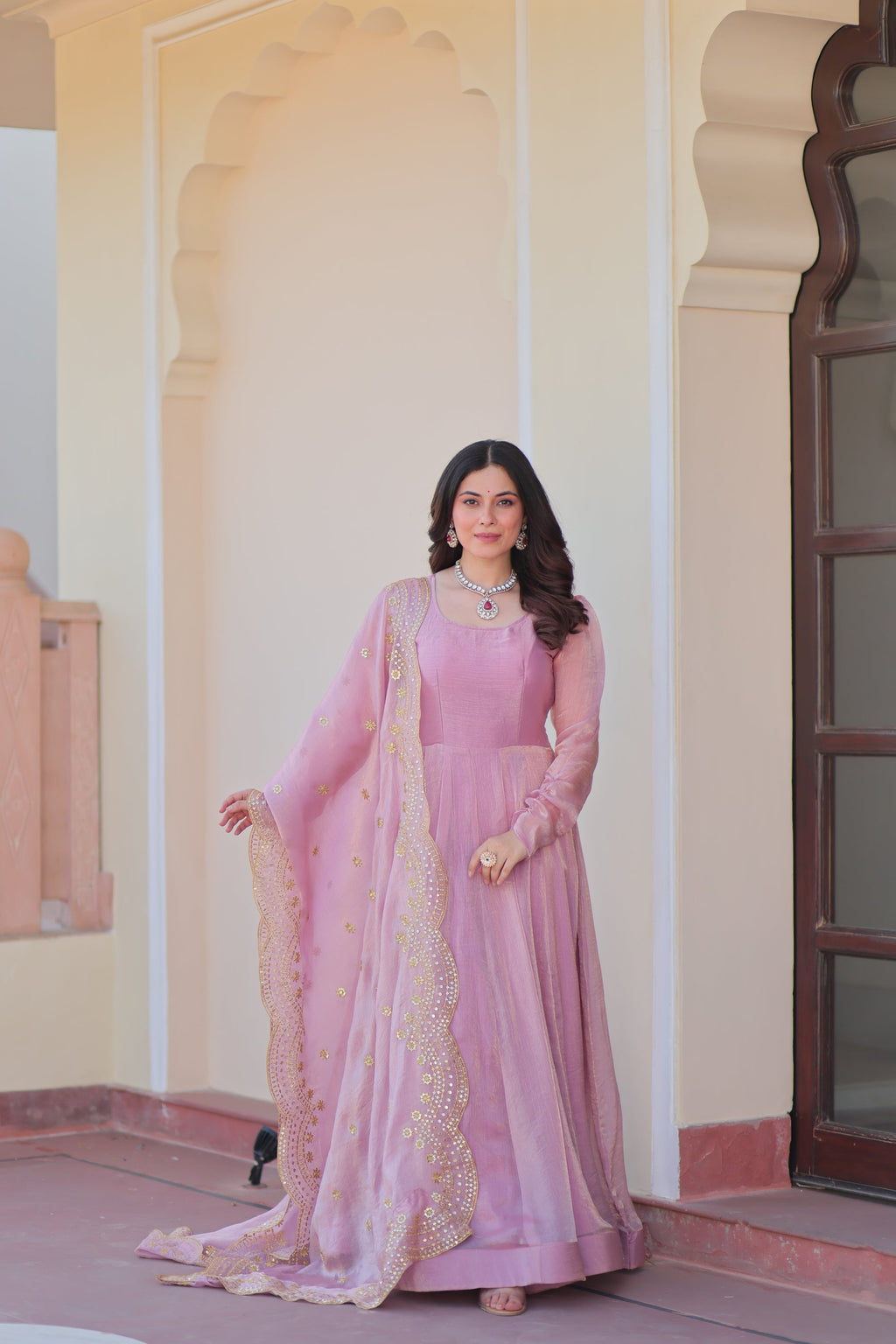 Bhargavi Pink Gown Set – Fendy chiffon gown with 12 kali stitching, full sleeves, and 3.5 meter flair; paired with a sequins and zari embroidered cut-work chiffon dupatta – ideal for weddings, sangeet, and festive occasions.