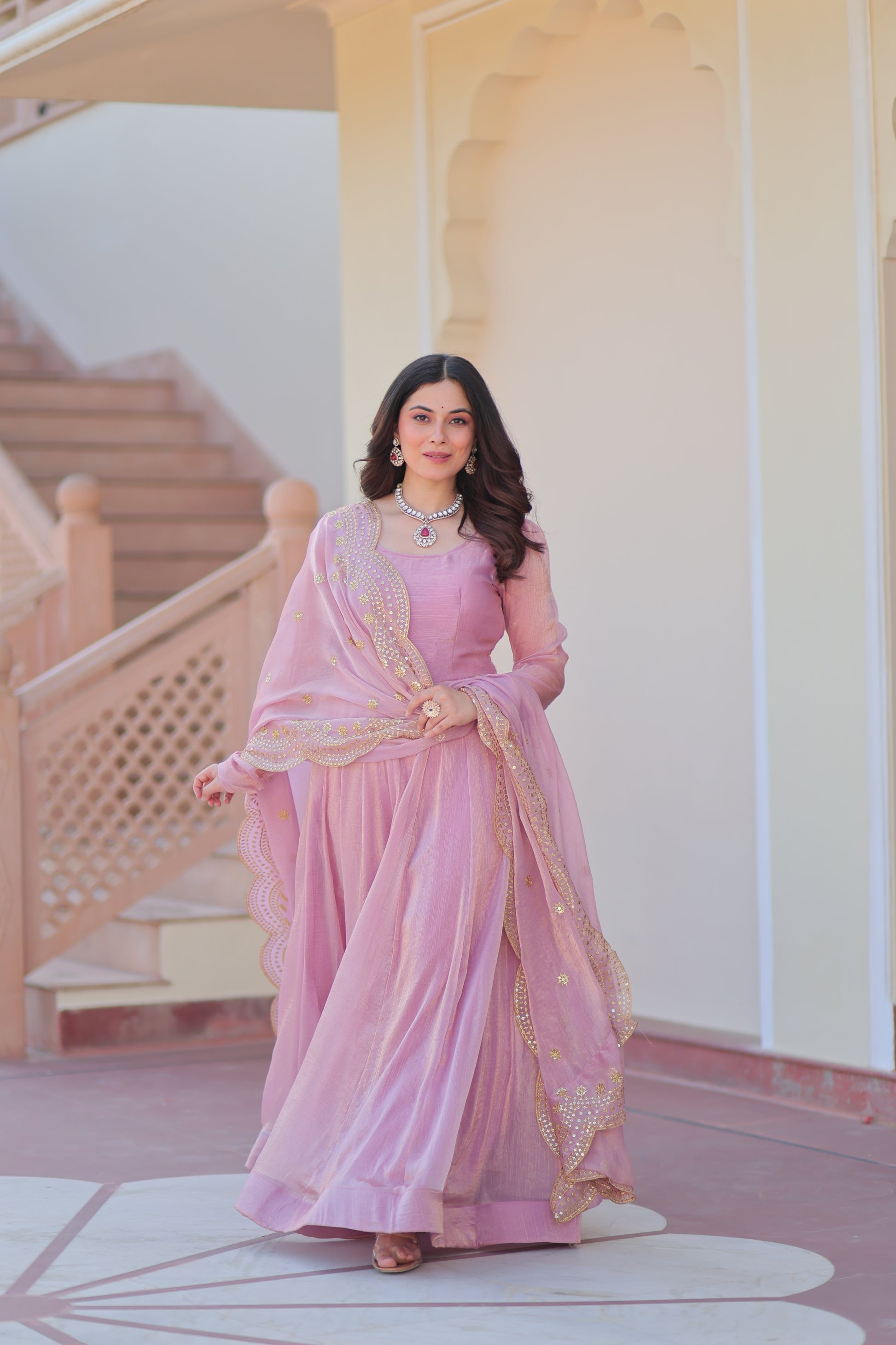 Bhargavi Pink Gown Set – Fendy chiffon gown with 12 kali stitching, full sleeves, and 3.5 meter flair; paired with a sequins and zari embroidered cut-work chiffon dupatta – ideal for weddings, sangeet, and festive occasions.