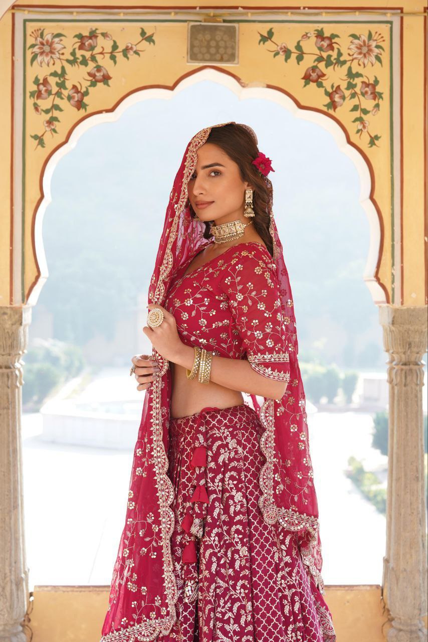 Kaushiki red embroidered lehenga set
