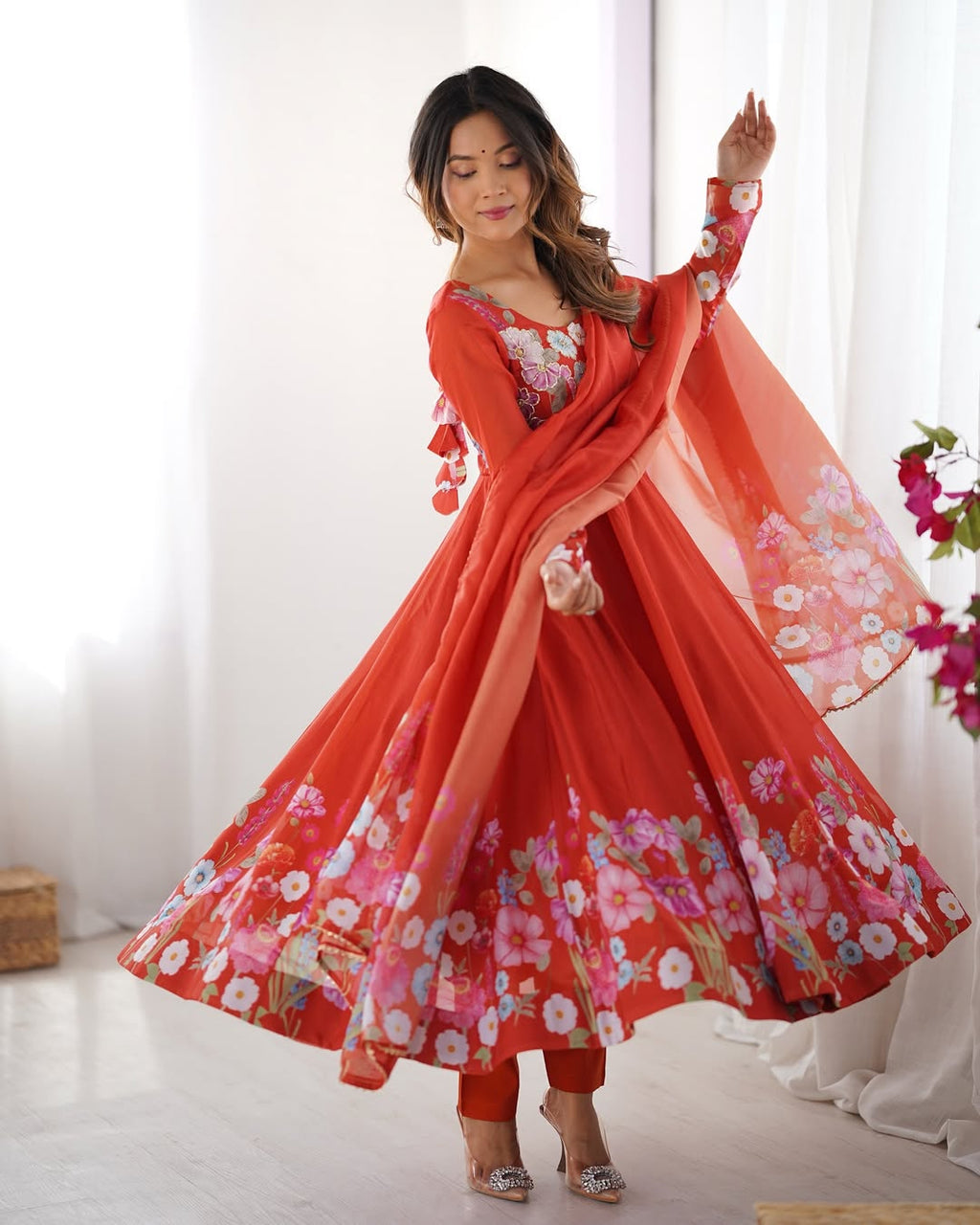 Darshika Orange Organza Floral Printed Anarkali Suit Set – fully stitched 4+ meter flared Anarkali in soft organza silk with badla zari and floral print work, paired with micro cotton pant and matching organza dupatta featuring gota patti lace; perfect ethnic outfit for weddings, festivals, and traditional occasions.