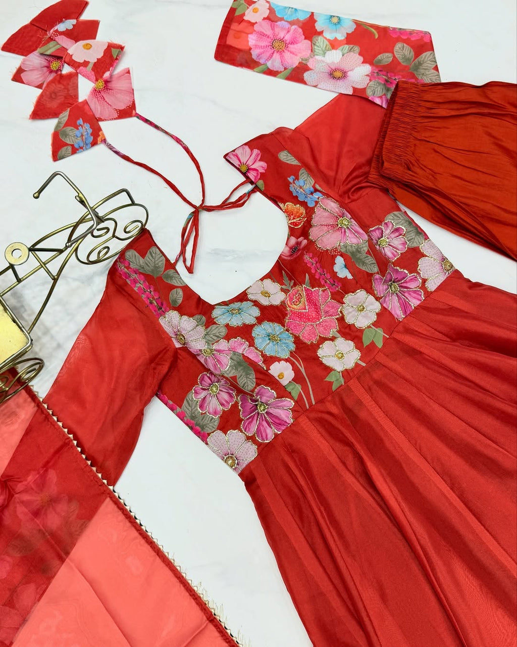 Darshika Orange Organza Floral Printed Anarkali Suit Set – fully stitched 4+ meter flared Anarkali in soft organza silk with badla zari and floral print work, paired with micro cotton pant and matching organza dupatta featuring gota patti lace; perfect ethnic outfit for weddings, festivals, and traditional occasions.