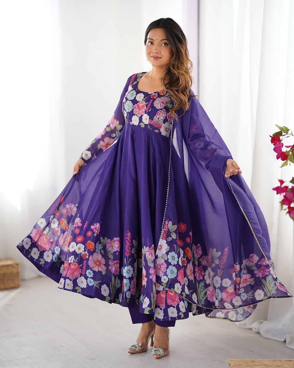  Darshika purple organza silk floral printed Anarkali suit set featuring zari work and Gota Patti lace border on the dupatta, paired with micro cotton pants – perfect for weddings, festivals, and luxury Indian ethnic wear in 2025.