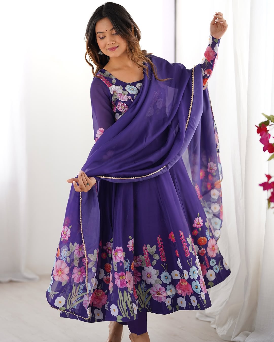  Darshika purple organza silk floral printed Anarkali suit set featuring zari work and Gota Patti lace border on the dupatta, paired with micro cotton pants – perfect for weddings, festivals, and luxury Indian ethnic wear in 2025.
