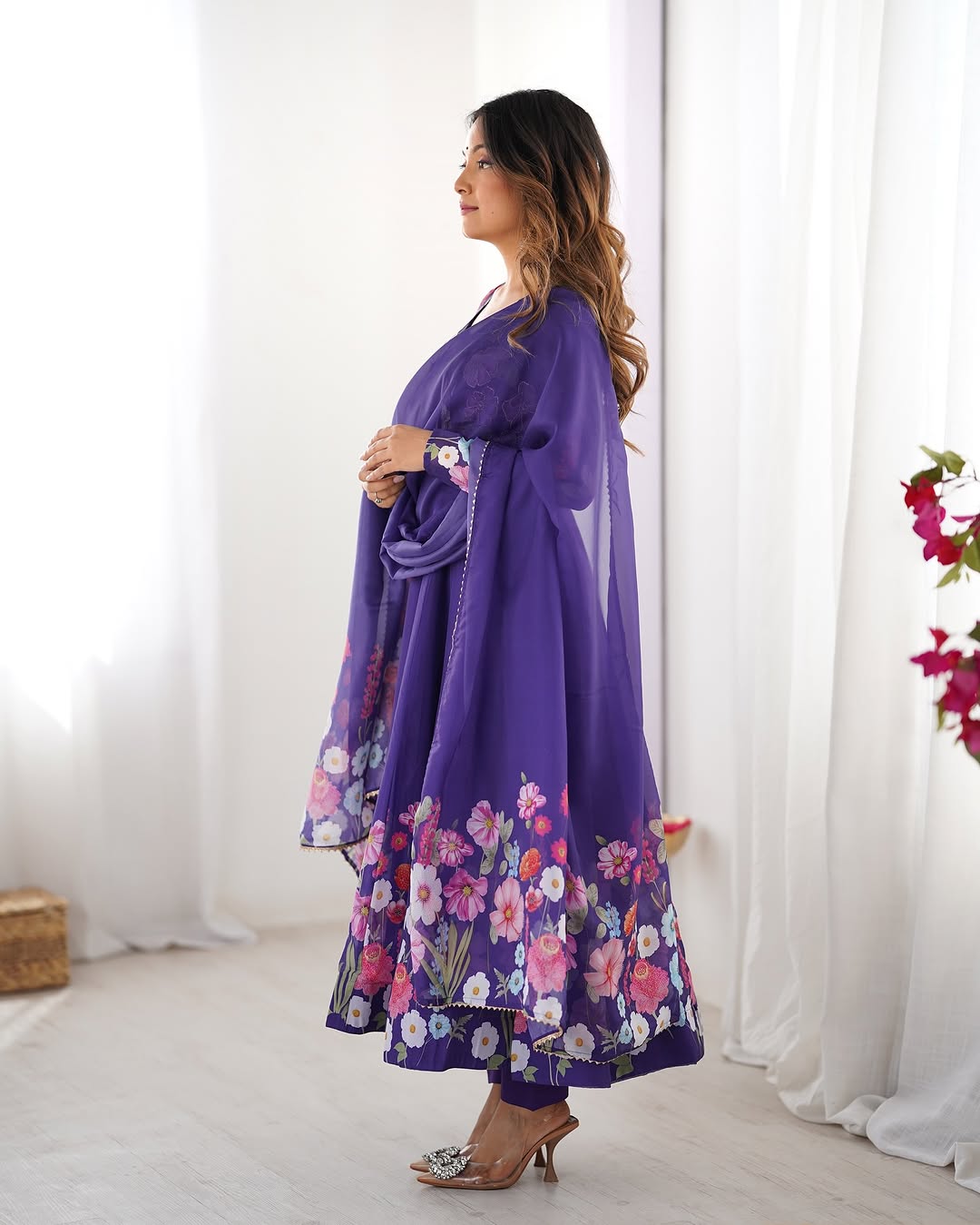  Darshika purple organza silk floral printed Anarkali suit set featuring zari work and Gota Patti lace border on the dupatta, paired with micro cotton pants – perfect for weddings, festivals, and luxury Indian ethnic wear in 2025.