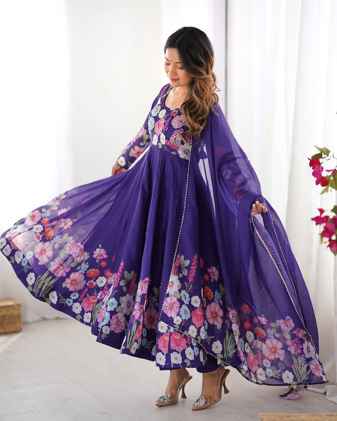  Darshika purple organza silk floral printed Anarkali suit set featuring zari work and Gota Patti lace border on the dupatta, paired with micro cotton pants – perfect for weddings, festivals, and luxury Indian ethnic wear in 2025.