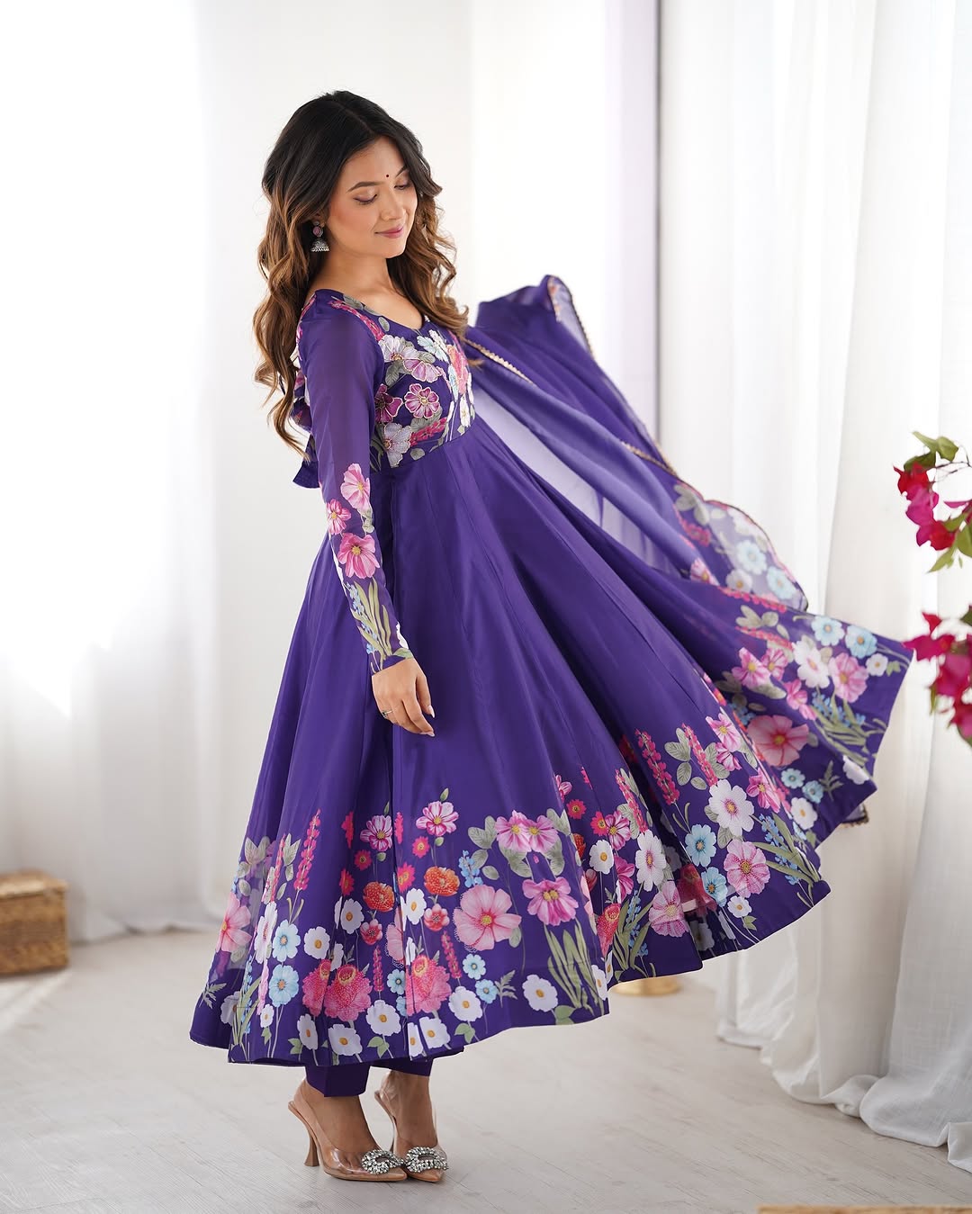  Darshika purple organza silk floral printed Anarkali suit set featuring zari work and Gota Patti lace border on the dupatta, paired with micro cotton pants – perfect for weddings, festivals, and luxury Indian ethnic wear in 2025.
