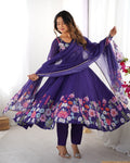  Darshika purple organza silk floral printed Anarkali suit set featuring zari work and Gota Patti lace border on the dupatta, paired with micro cotton pants – perfect for weddings, festivals, and luxury Indian ethnic wear in 2025.