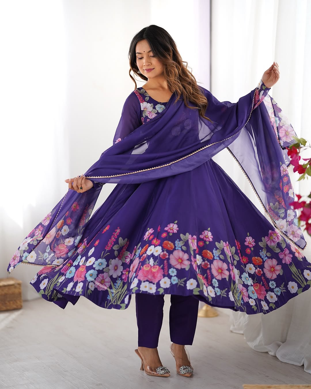  Darshika purple organza silk floral printed Anarkali suit set featuring zari work and Gota Patti lace border on the dupatta, paired with micro cotton pants – perfect for weddings, festivals, and luxury Indian ethnic wear in 2025.