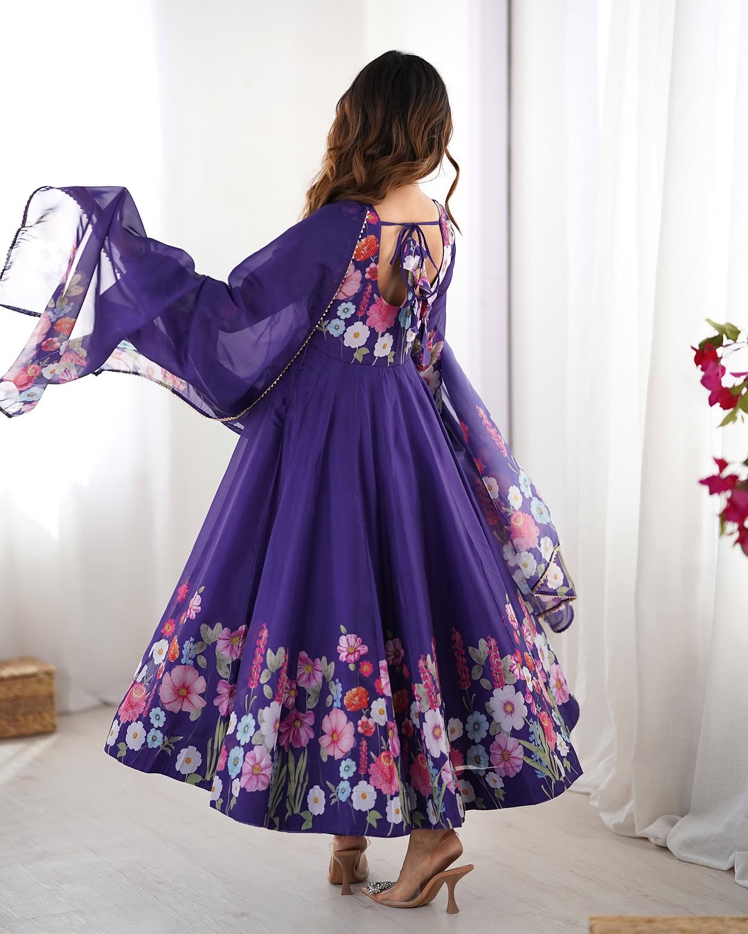  Darshika purple organza silk floral printed Anarkali suit set featuring zari work and Gota Patti lace border on the dupatta, paired with micro cotton pants – perfect for weddings, festivals, and luxury Indian ethnic wear in 2025.