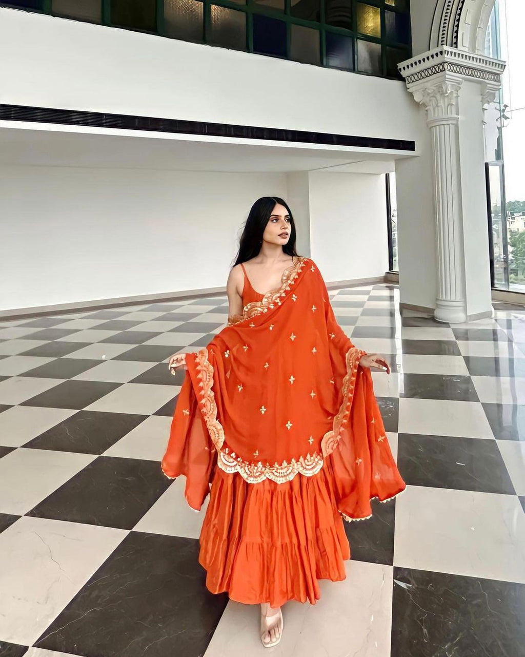 Devayani orange georgette anarkali gown set