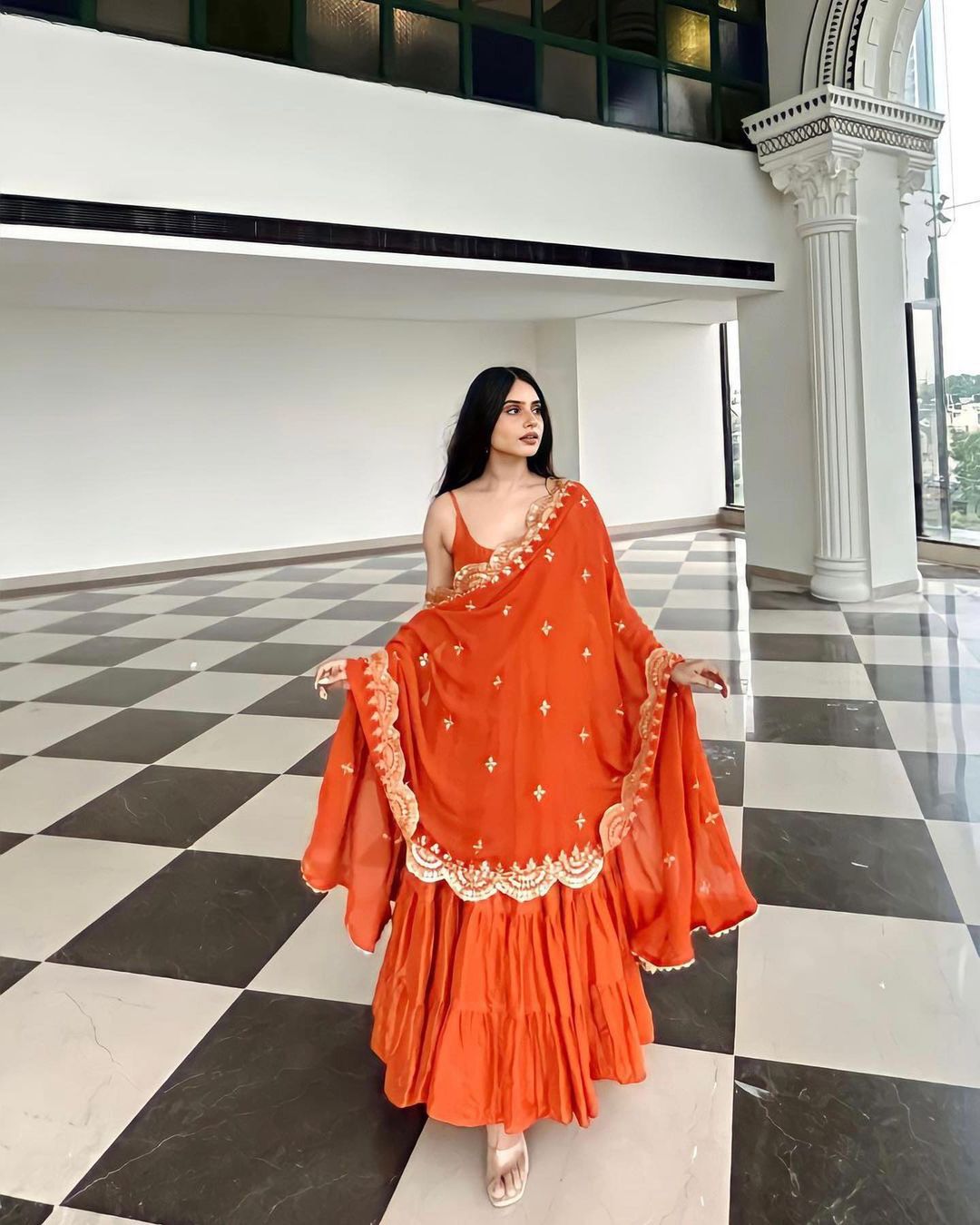 Devayani orange georgette anarkali gown set