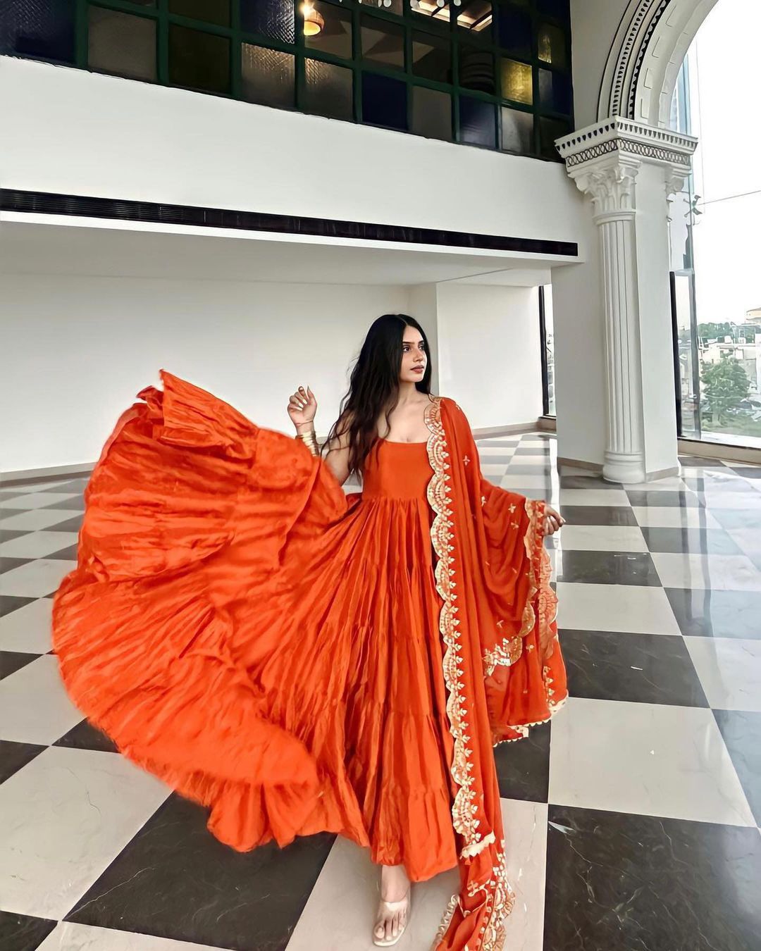 Devayani orange georgette anarkali gown set