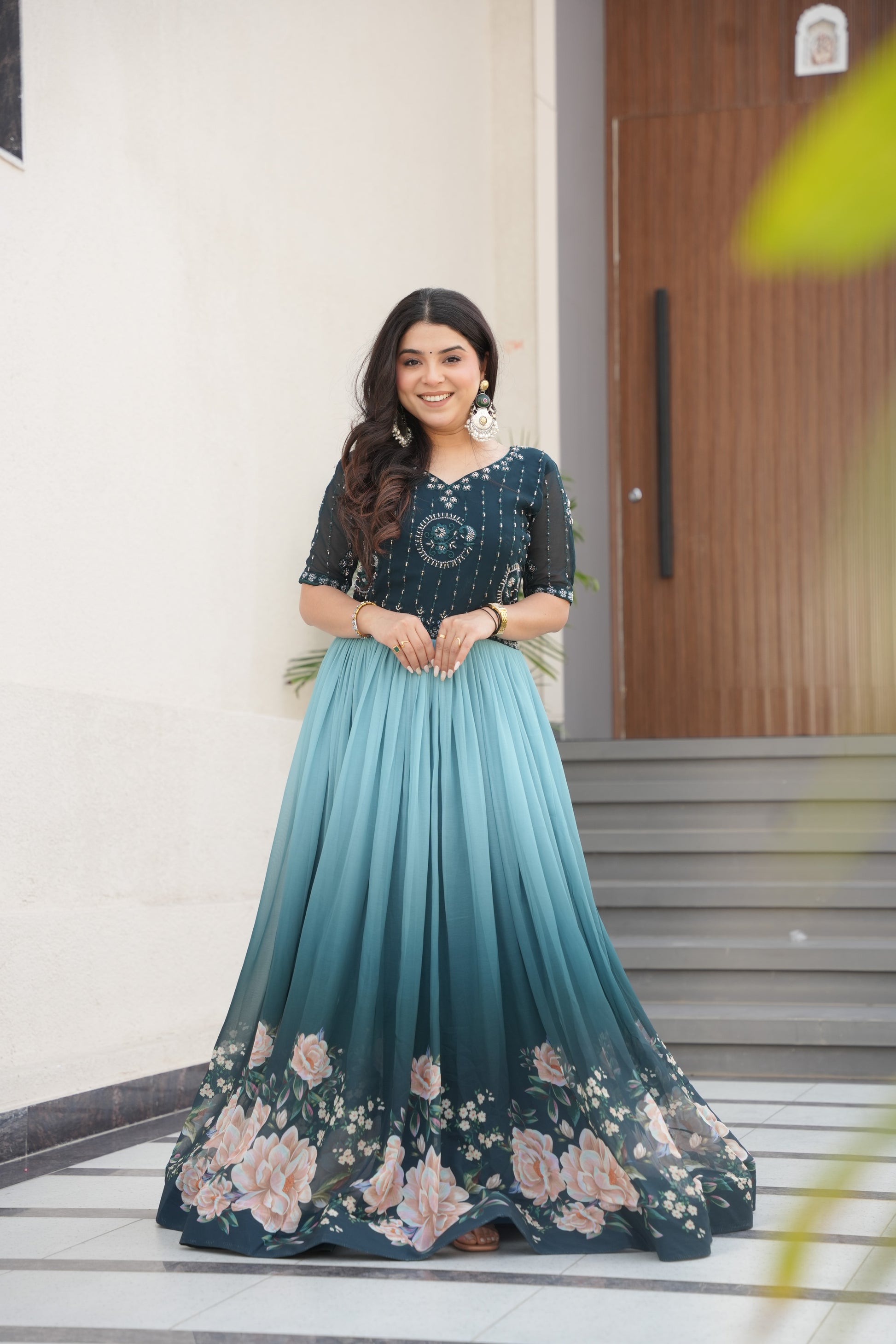 Hemrika Rama Color Embroidered Gown – designer rama green ethnic gown for women with floral digital print and beads embroidery, premium faux blooming floor-length gown, half sleeve Anarkali gown with round neckline, canvas patta stitching for extra flair, elegant Indian partywear and festive gown, fully lined with cotton for comfort, Trinaari ready to wear ethnic gown.