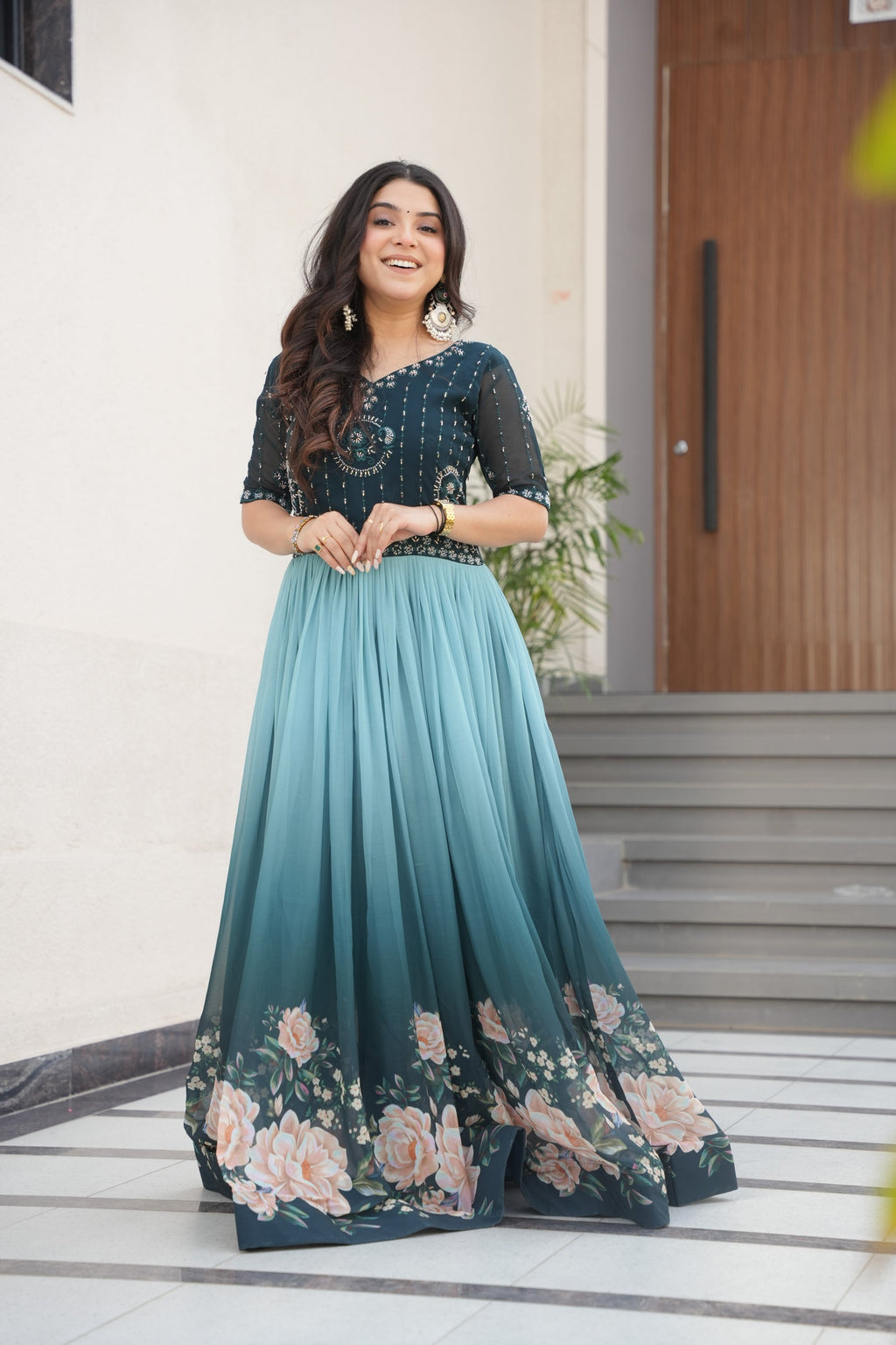 Hemrika Rama Color Embroidered Gown – designer rama green ethnic gown for women with floral digital print and beads embroidery, premium faux blooming floor-length gown, half sleeve Anarkali gown with round neckline, canvas patta stitching for extra flair, elegant Indian partywear and festive gown, fully lined with cotton for comfort, Trinaari ready to wear ethnic gown.