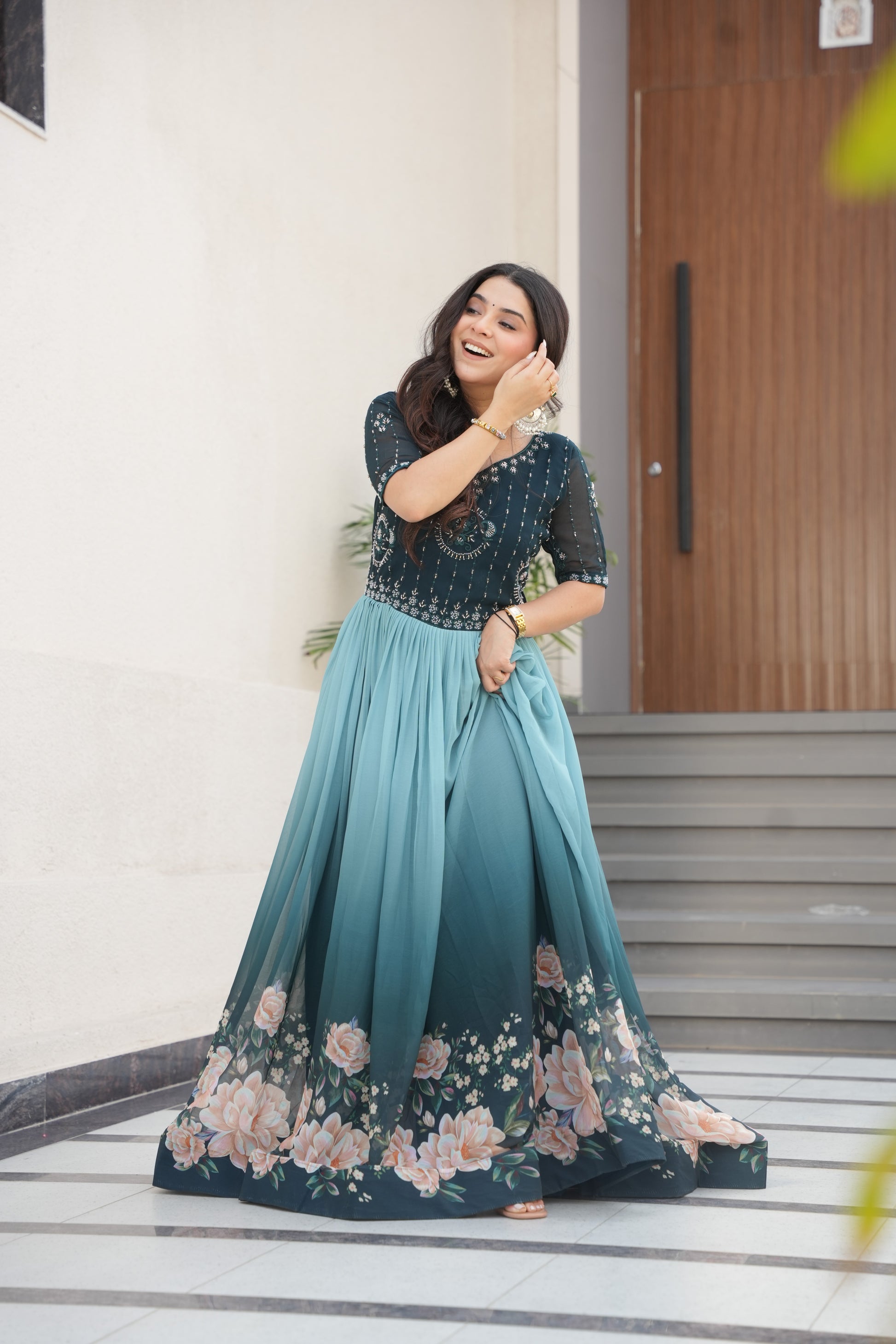 Hemrika Rama Color Embroidered Gown – designer rama green ethnic gown for women with floral digital print and beads embroidery, premium faux blooming floor-length gown, half sleeve Anarkali gown with round neckline, canvas patta stitching for extra flair, elegant Indian partywear and festive gown, fully lined with cotton for comfort, Trinaari ready to wear ethnic gown.