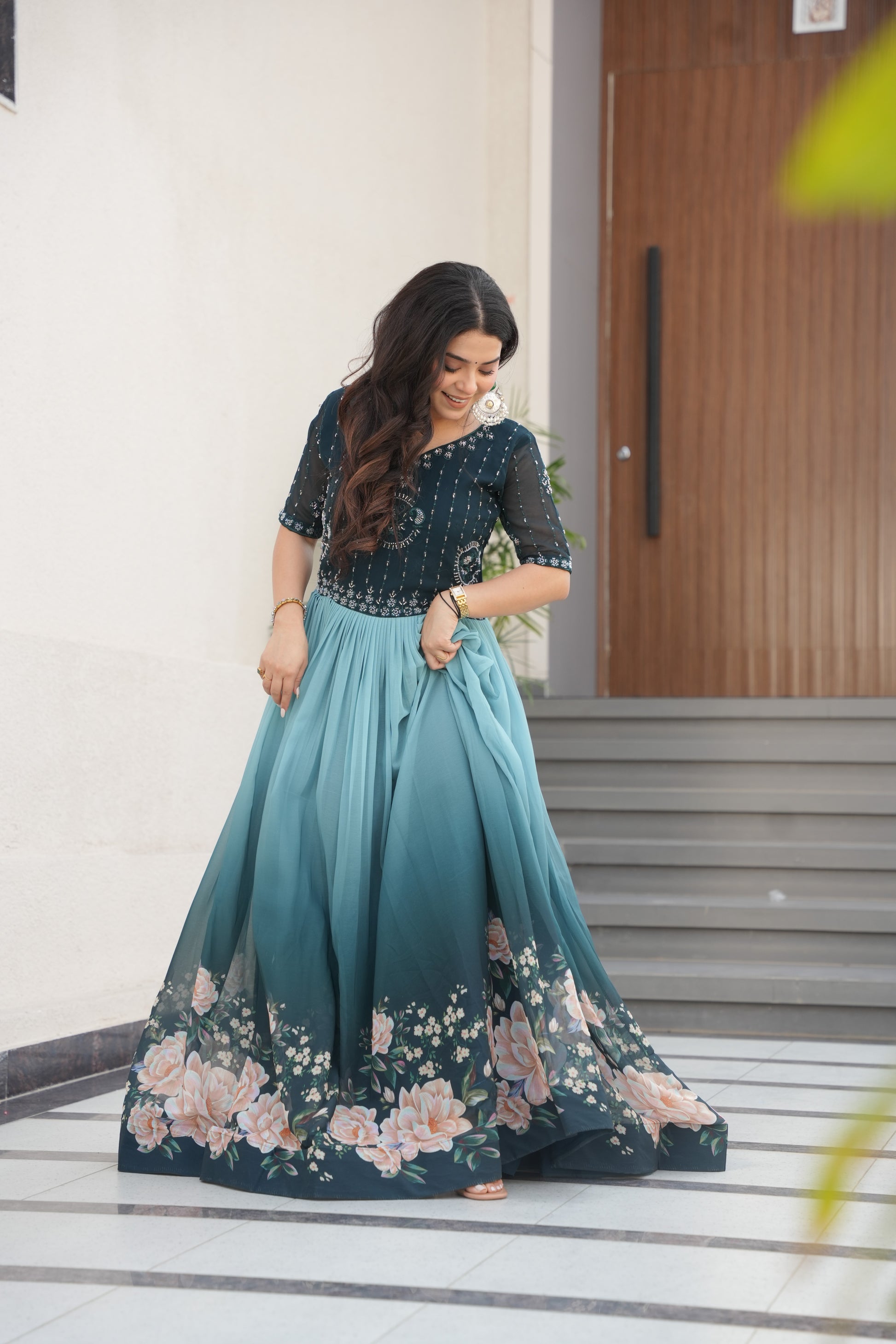 Hemrika Rama Color Embroidered Gown – designer rama green ethnic gown for women with floral digital print and beads embroidery, premium faux blooming floor-length gown, half sleeve Anarkali gown with round neckline, canvas patta stitching for extra flair, elegant Indian partywear and festive gown, fully lined with cotton for comfort, Trinaari ready to wear ethnic gown.