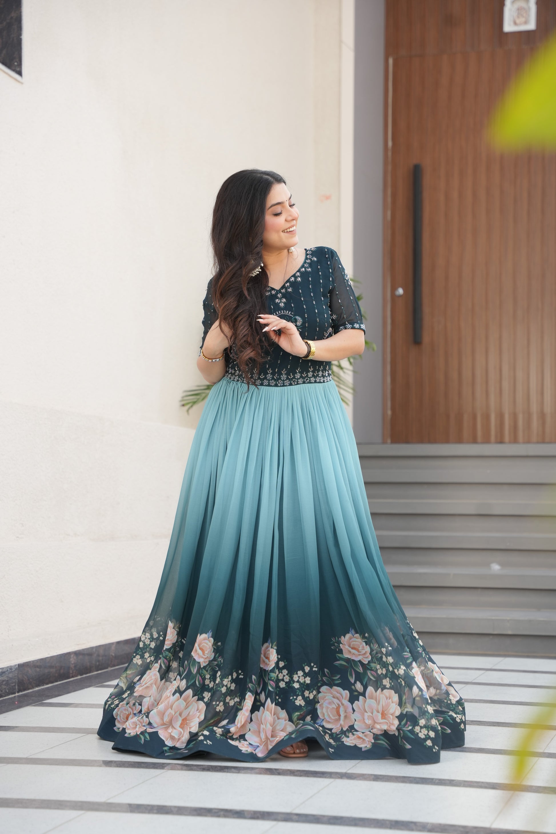 Hemrika Rama Color Embroidered Gown – designer rama green ethnic gown for women with floral digital print and beads embroidery, premium faux blooming floor-length gown, half sleeve Anarkali gown with round neckline, canvas patta stitching for extra flair, elegant Indian partywear and festive gown, fully lined with cotton for comfort, Trinaari ready to wear ethnic gown.