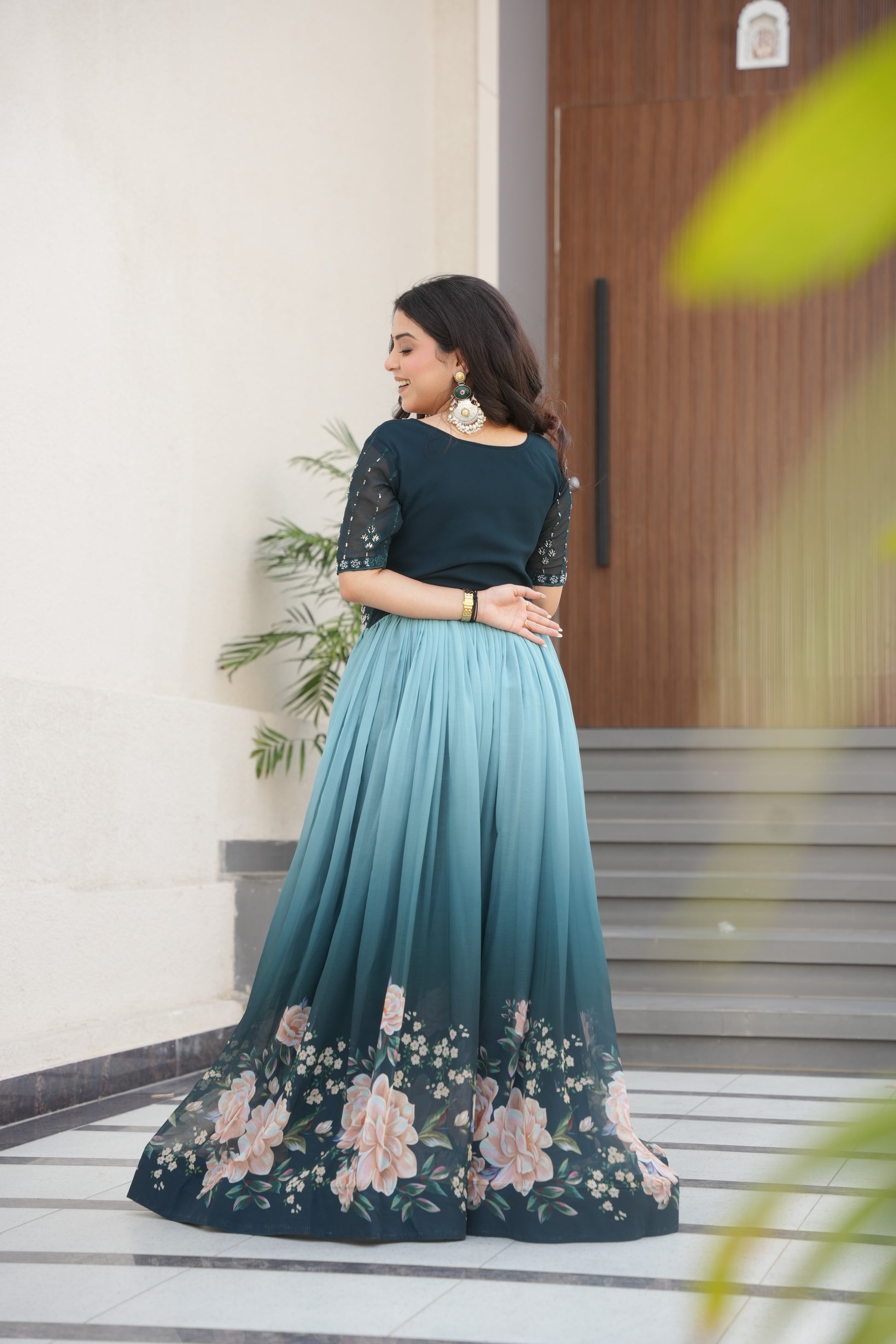 Hemrika Rama Color Embroidered Gown – designer rama green ethnic gown for women with floral digital print and beads embroidery, premium faux blooming floor-length gown, half sleeve Anarkali gown with round neckline, canvas patta stitching for extra flair, elegant Indian partywear and festive gown, fully lined with cotton for comfort, Trinaari ready to wear ethnic gown.