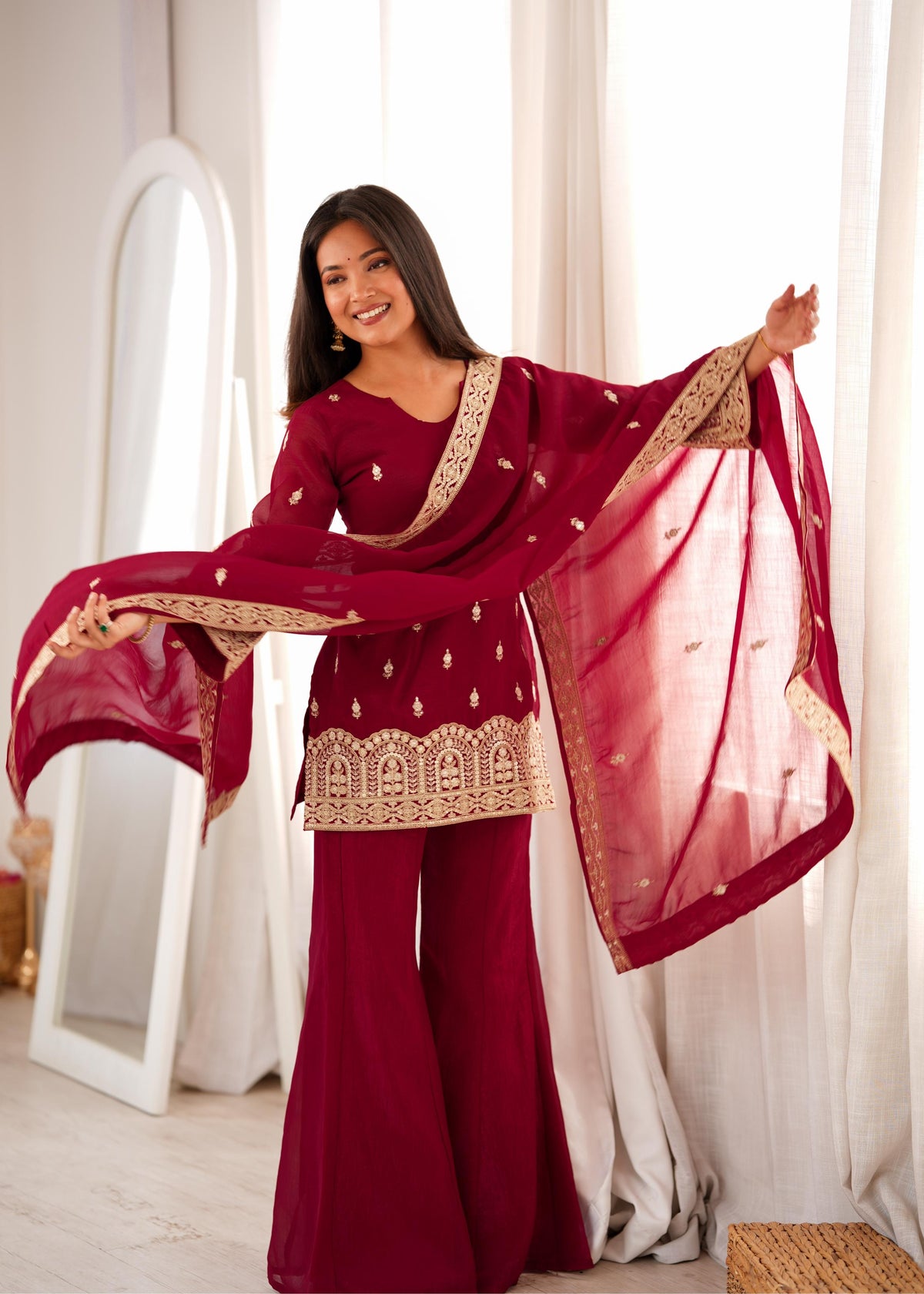 Royal Burgundy Embroidered Palazzo Suit with Intricate Golden Zari Work, Statement Cuffs & Matching Border Dupatta