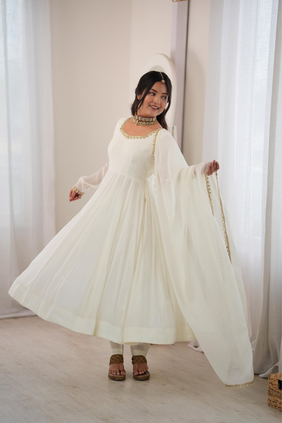 Elegant Ivory Anarkali Gown with Sheer Sleeves, Golden Neckline Embellishment & Matching Dupatta