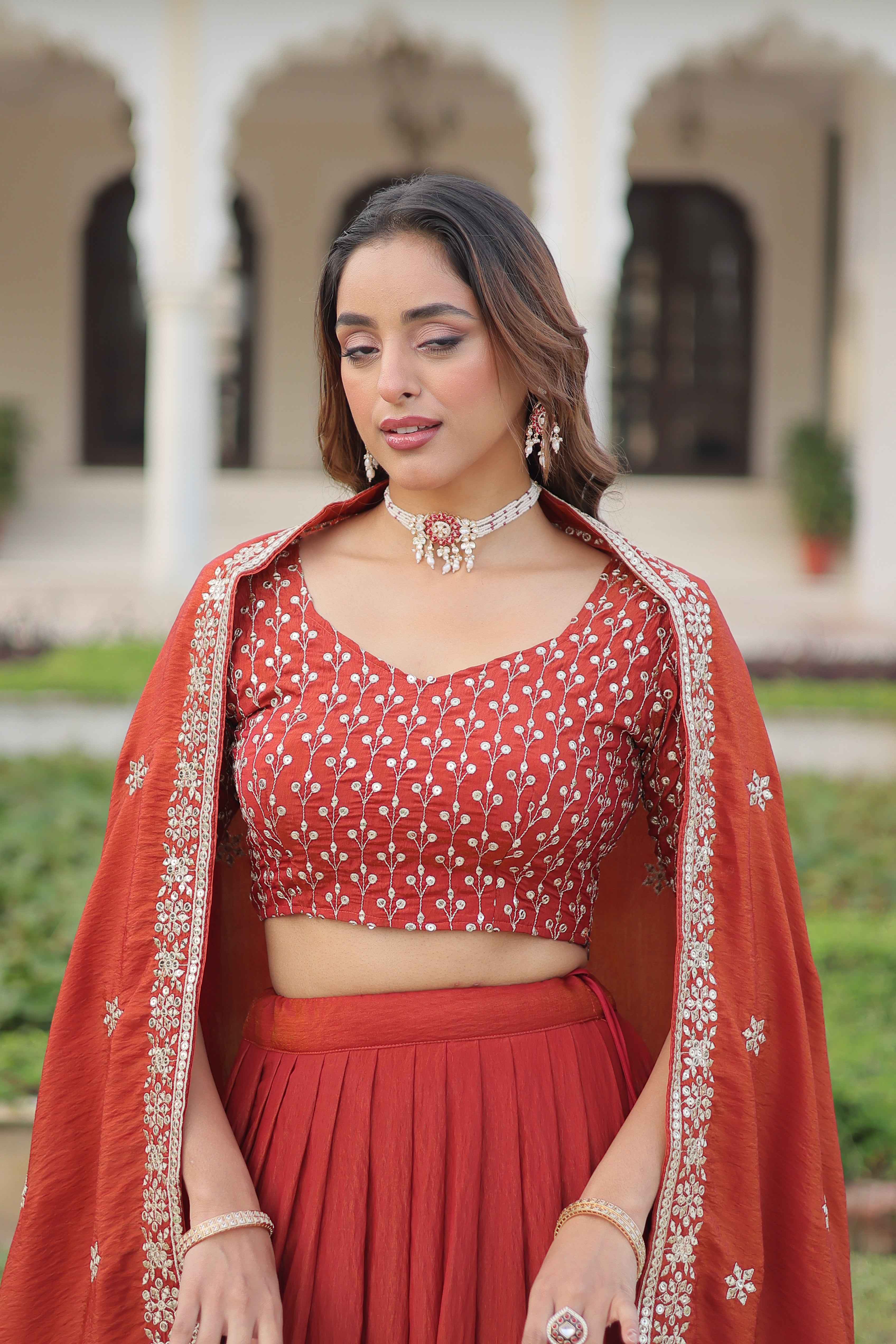 Omira Orange Color Vichitra Silk Sequins Thread Embroidered Lehenga Choli