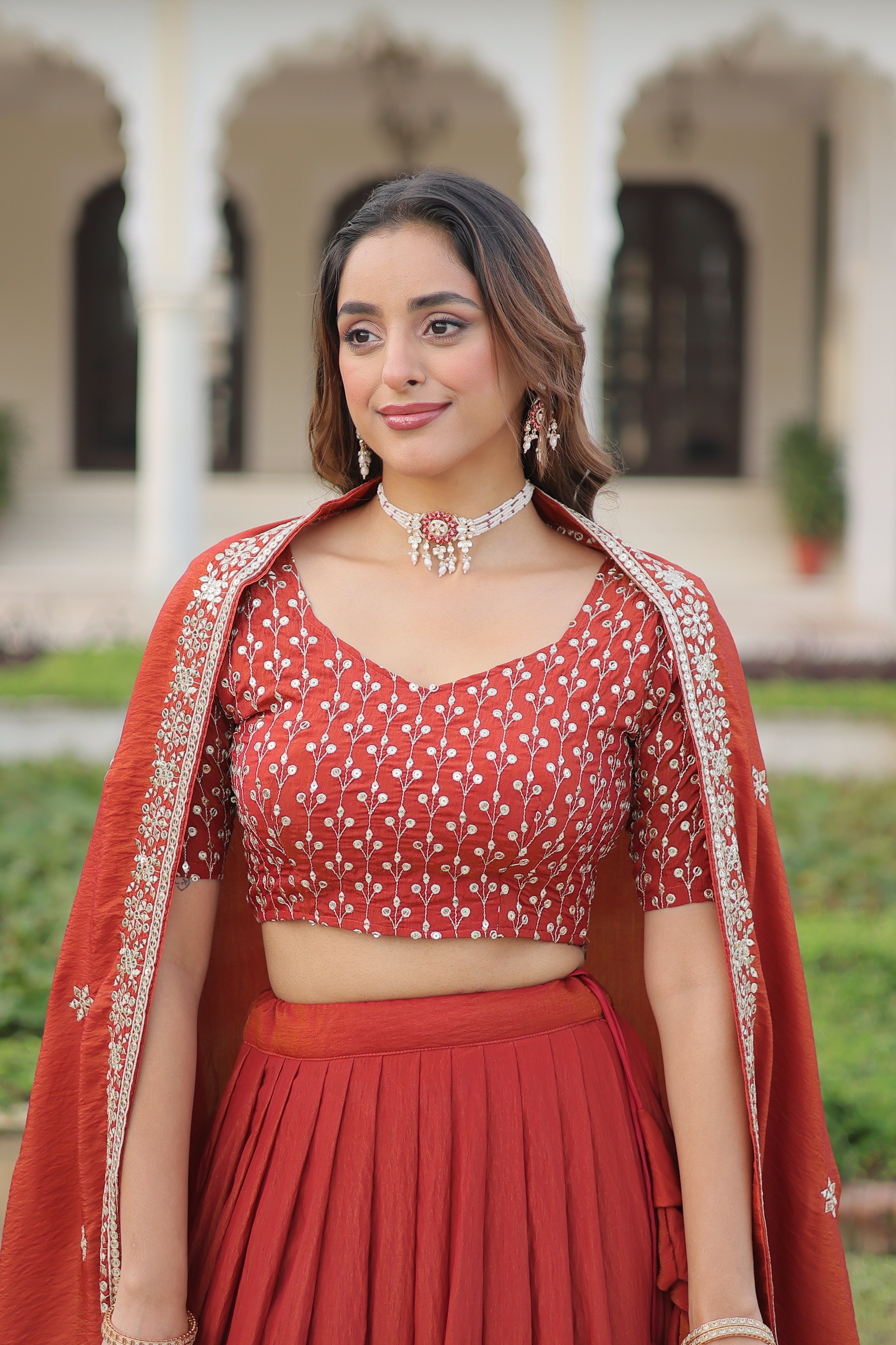 Omira Orange Color Vichitra Silk Sequins Thread Embroidered Lehenga Choli