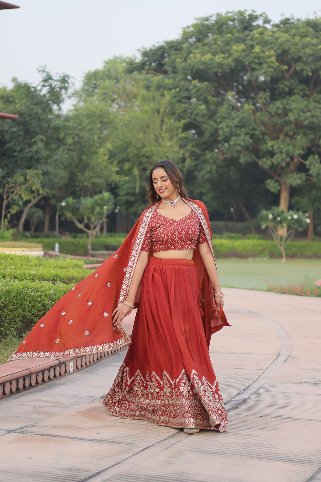 Omira Orange Color Vichitra Silk Sequins Thread Embroidered Lehenga Choli