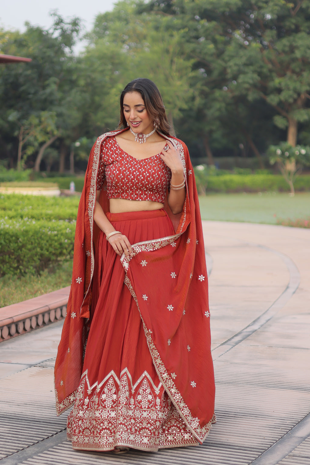 Omira Orange Color Vichitra Silk Sequins Thread Embroidered Lehenga Choli