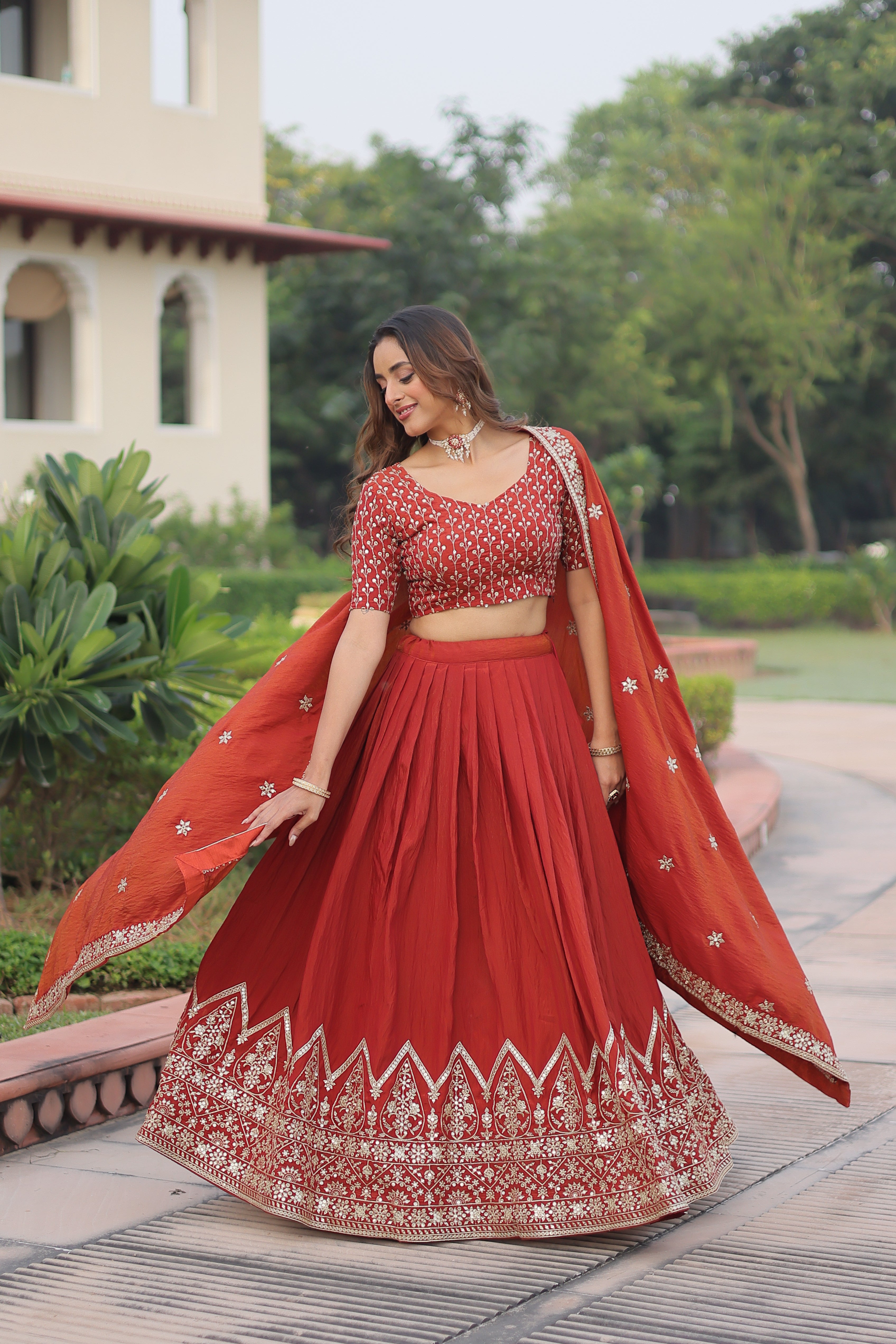 Omira Orange Color Vichitra Silk Sequins Thread Embroidered Lehenga Choli