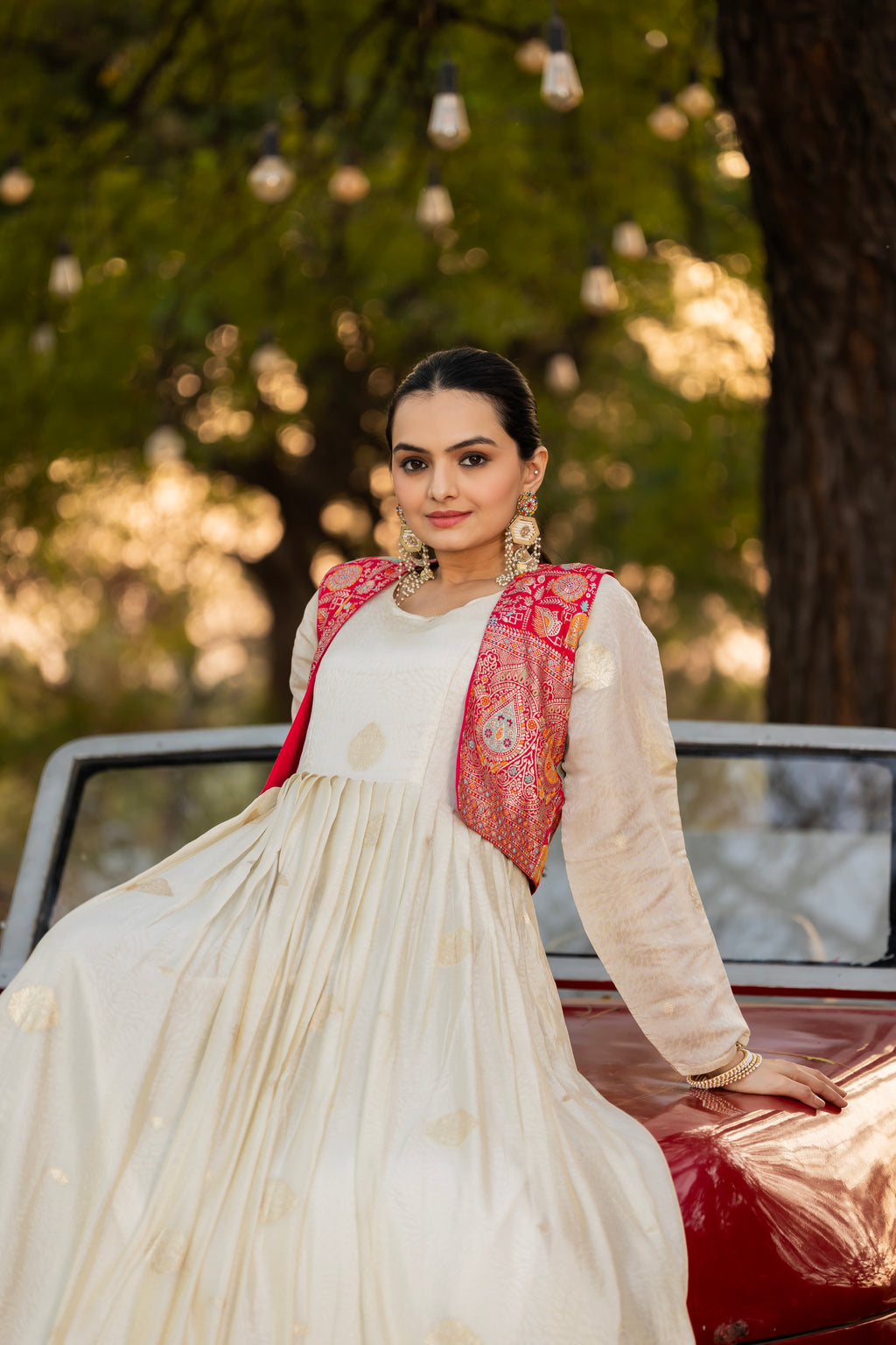 Off-white jacquard butti gown with pink koti
