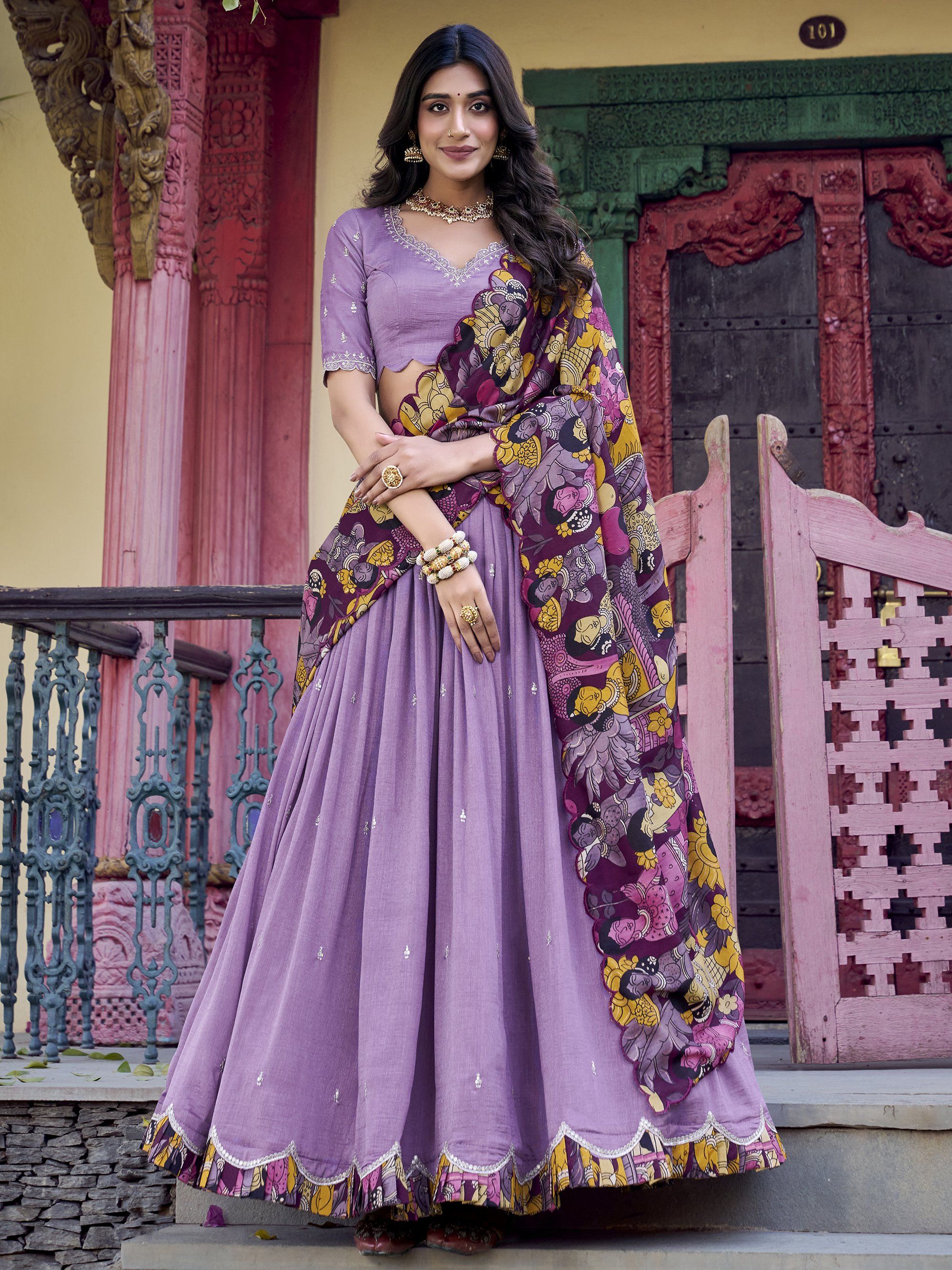 Elegant lavender Vichitra silk lehenga choli set with heavy sequins and thread embroidery, 4-meter flair, Kalamkari printed border and dupatta with scallop detailing – perfect for weddings and festive occasions