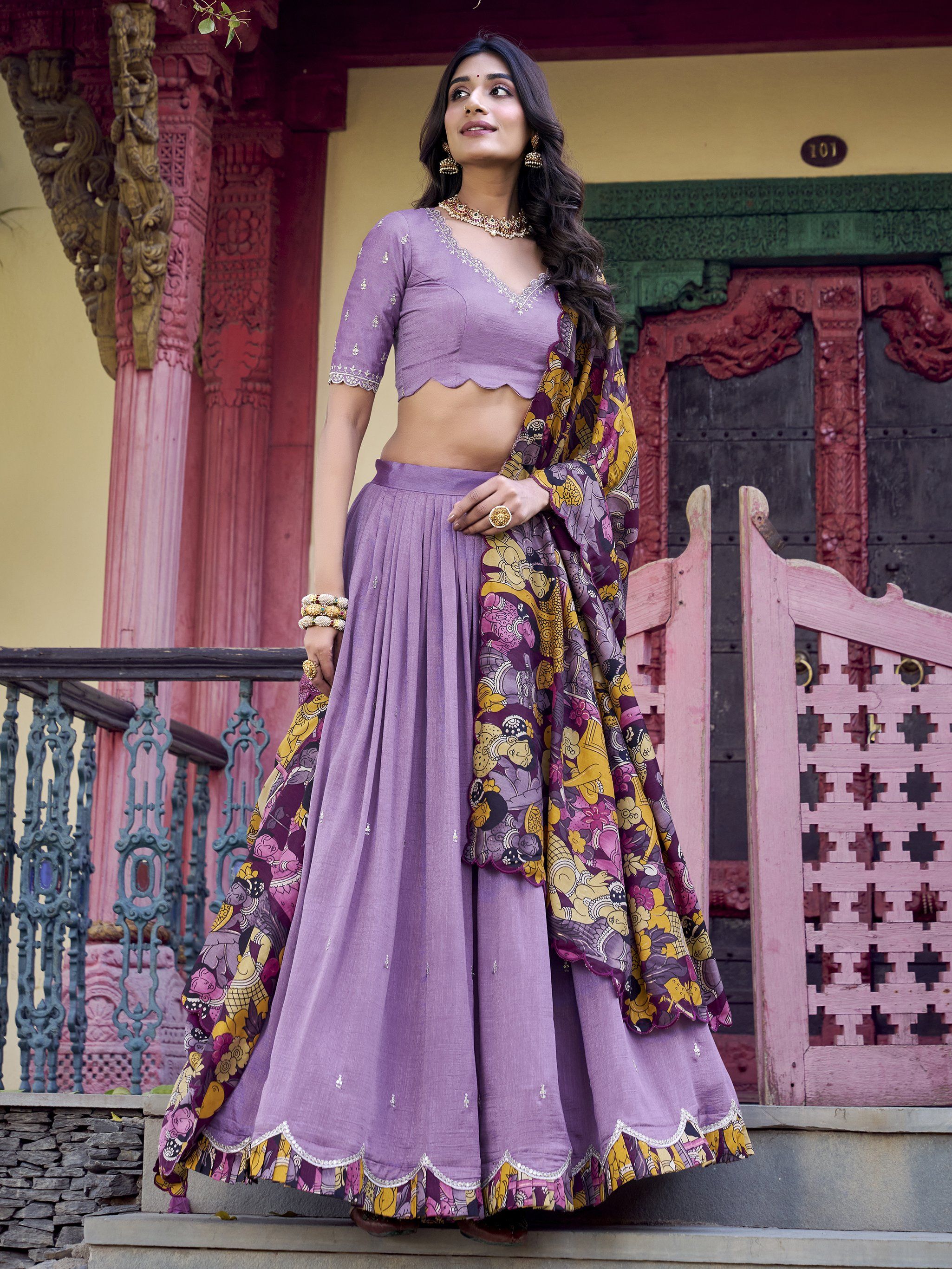 Elegant lavender Vichitra silk lehenga choli set with heavy sequins and thread embroidery, 4-meter flair, Kalamkari printed border and dupatta with scallop detailing – perfect for weddings and festive occasions