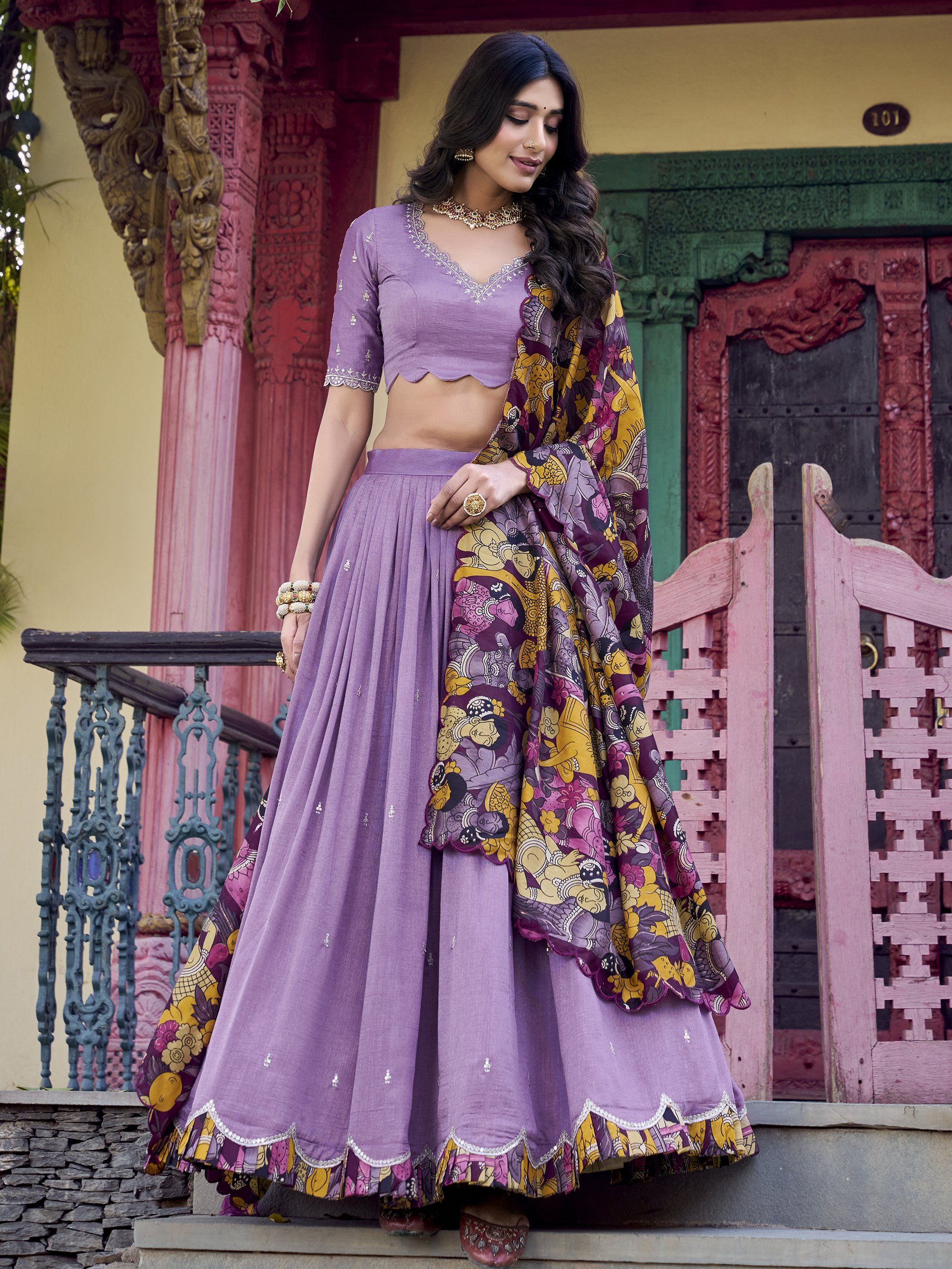 Elegant lavender Vichitra silk lehenga choli set with heavy sequins and thread embroidery, 4-meter flair, Kalamkari printed border and dupatta with scallop detailing – perfect for weddings and festive occasions