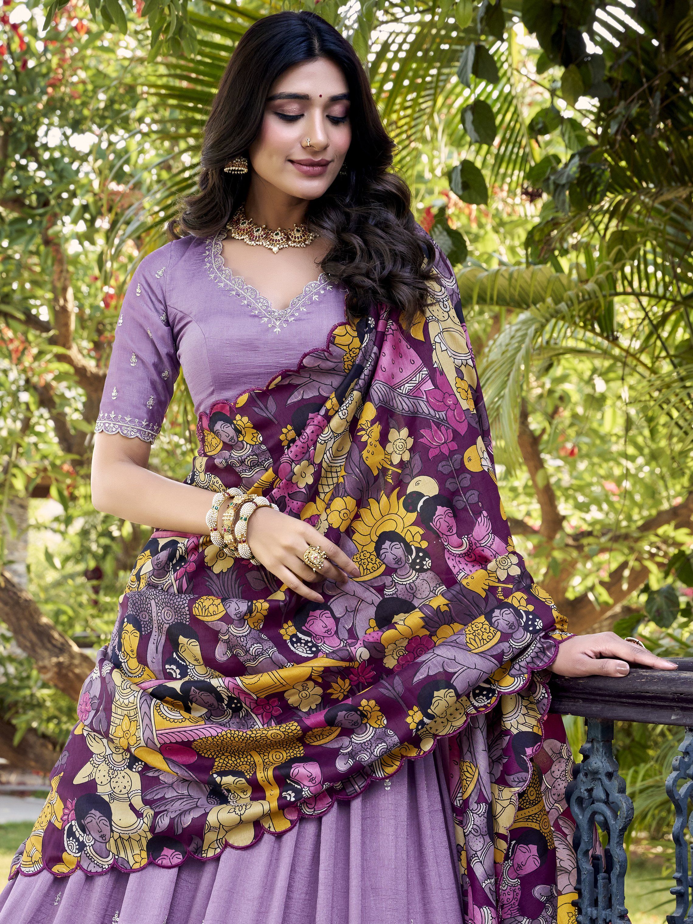 Elegant lavender Vichitra silk lehenga choli set with heavy sequins and thread embroidery, 4-meter flair, Kalamkari printed border and dupatta with scallop detailing – perfect for weddings and festive occasions