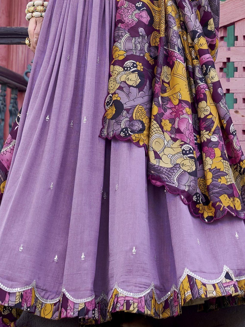 Elegant lavender Vichitra silk lehenga choli set with heavy sequins and thread embroidery, 4-meter flair, Kalamkari printed border and dupatta with scallop detailing – perfect for weddings and festive occasions