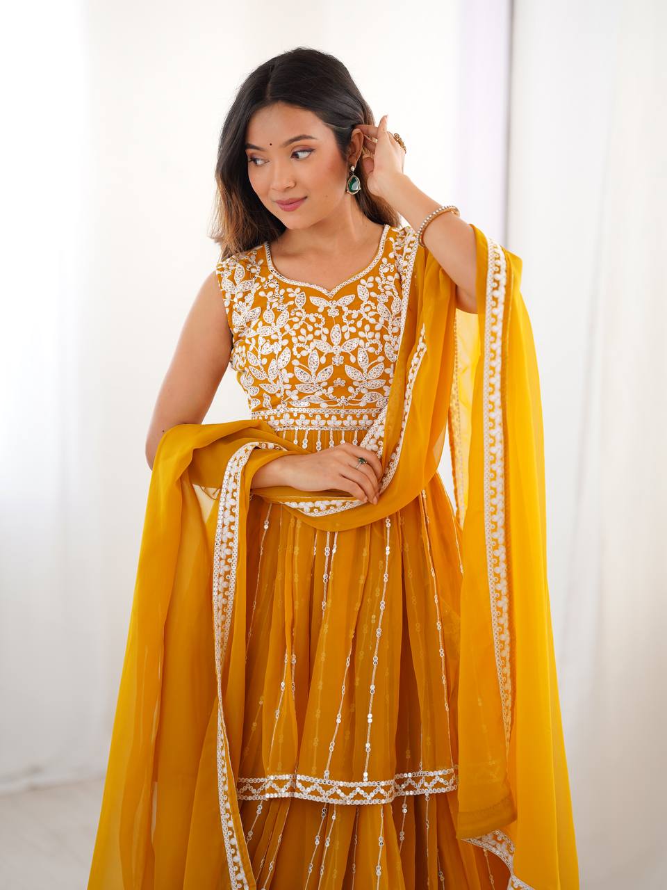 Mustard yellow georgette sequin embroidered lehenga with top