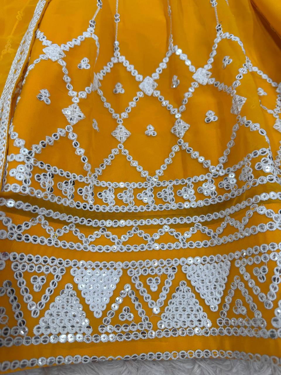 Mustard yellow georgette sequin embroidered lehenga with top