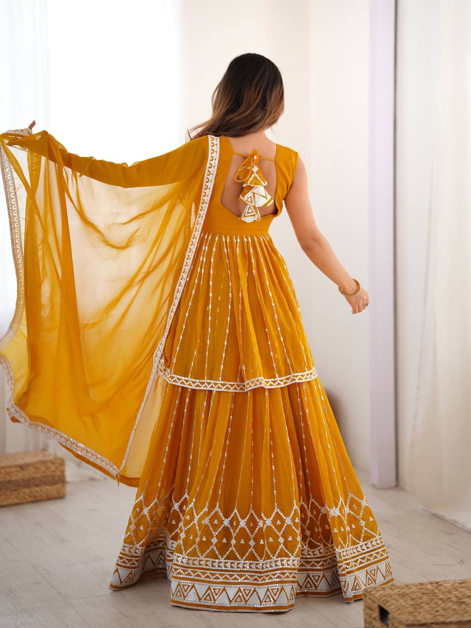 Mustard yellow georgette sequin embroidered lehenga with top