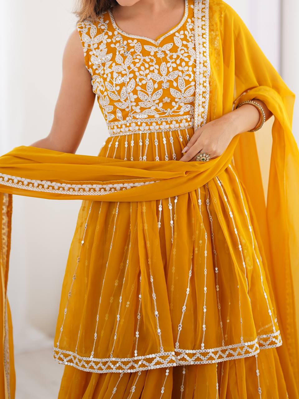 Mustard yellow georgette sequin embroidered lehenga with top