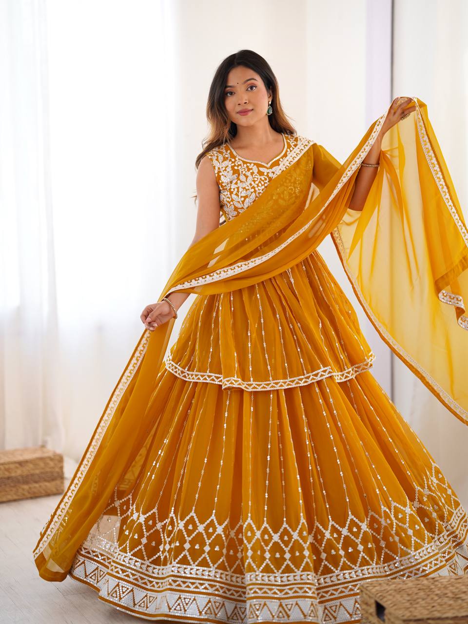 Mustard yellow georgette sequin embroidered lehenga with top