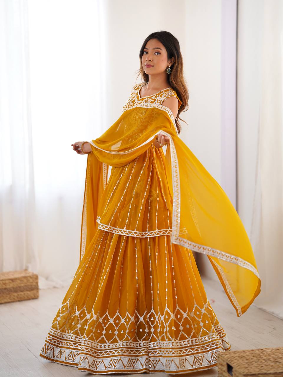 Mustard yellow georgette sequin embroidered lehenga with top