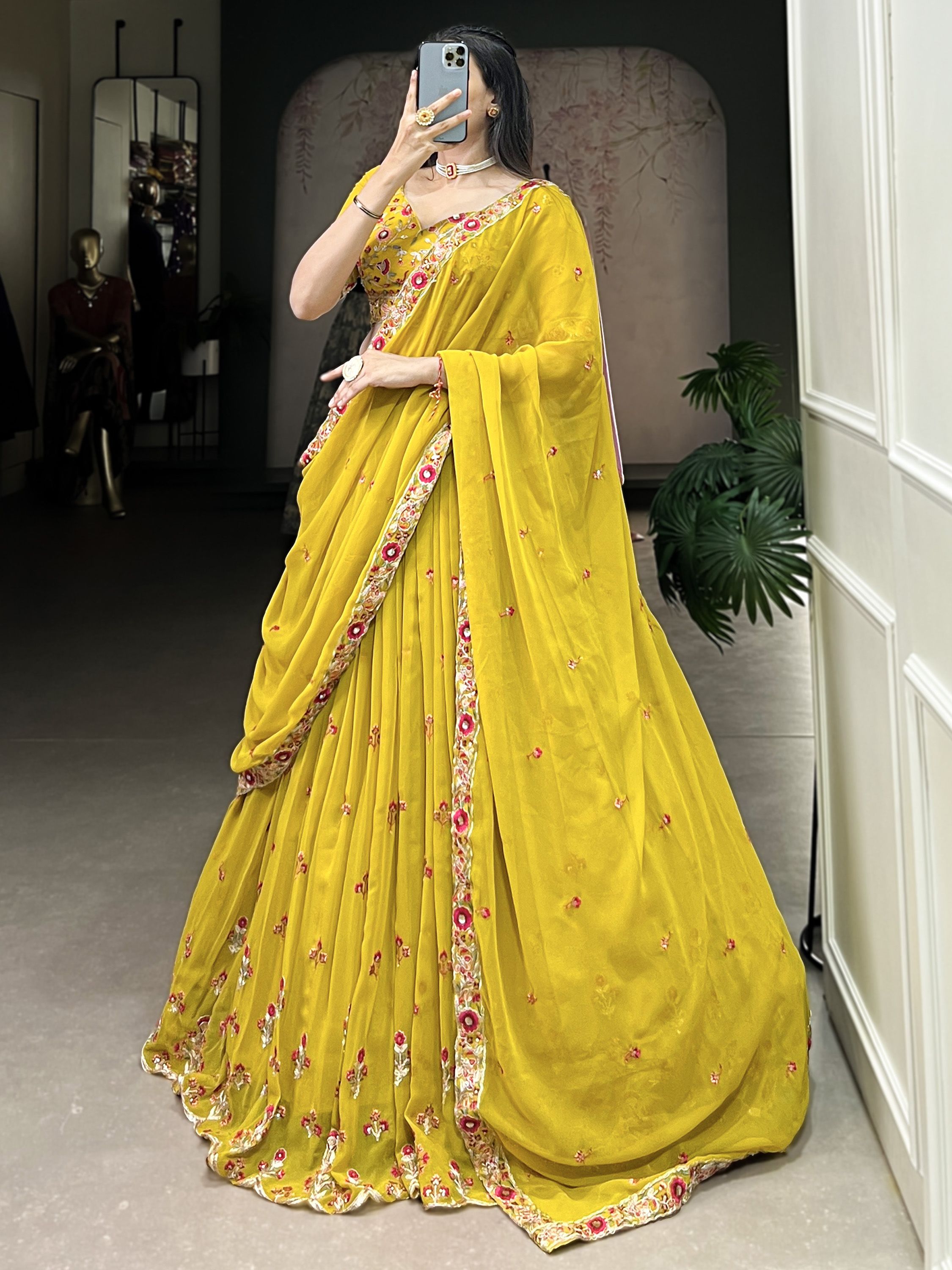 Neeva Yellow Thread Embroidered Georgette Lehenga Choli, perfect for Haldi ceremonies. This vibrant ensemble features intricate thread embroidery on soft georgette fabric, exuding elegance and festive charm. Paired with a beautifully designed choli and a matching dupatta, this lehenga set is a stunning choice for wedding celebrations and special occasions